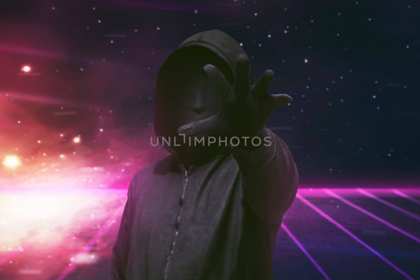 Hooded man with vendetta mask grabbing something over visual background