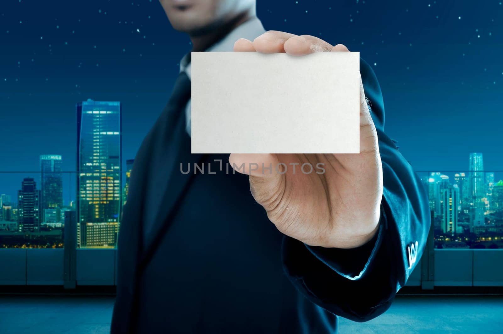 Business man holding name card isolated over white background
