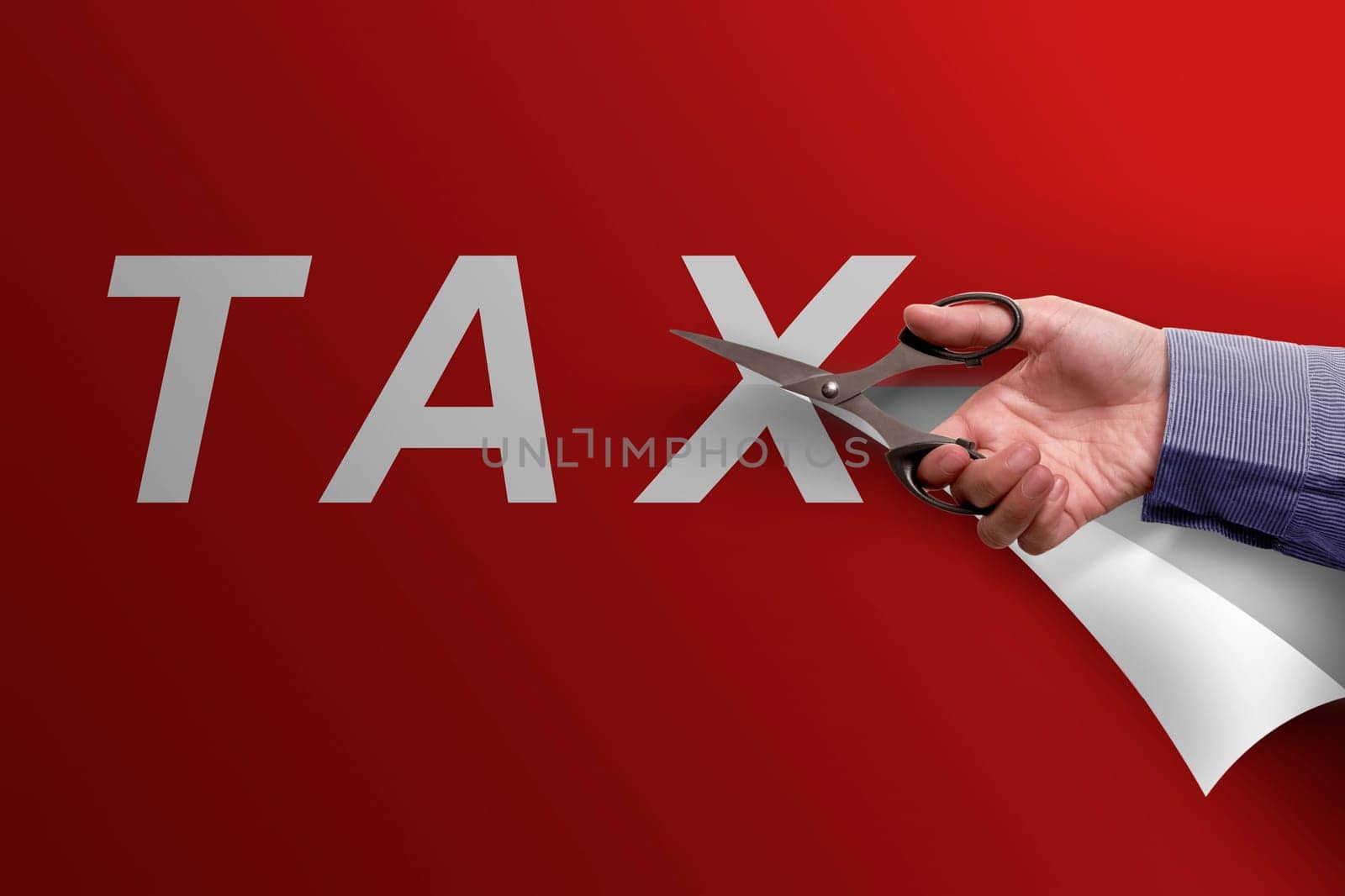 Business hand with scissors cutting Tax word on red paper