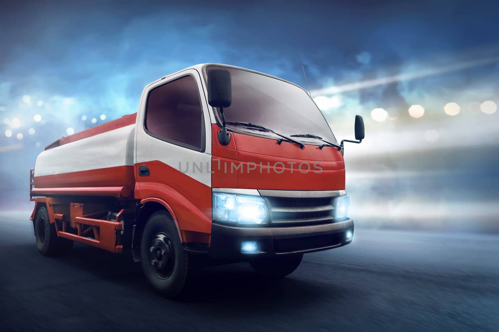 Truck with fuel tank along the asphalt road with dark concrete background