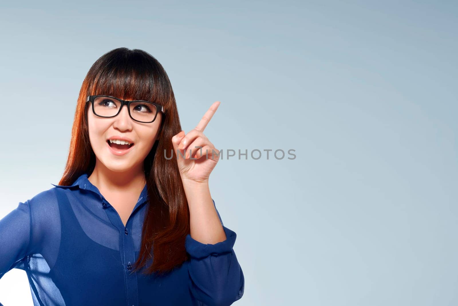 Beautiful asian business woman with thinking face expression against bright background
