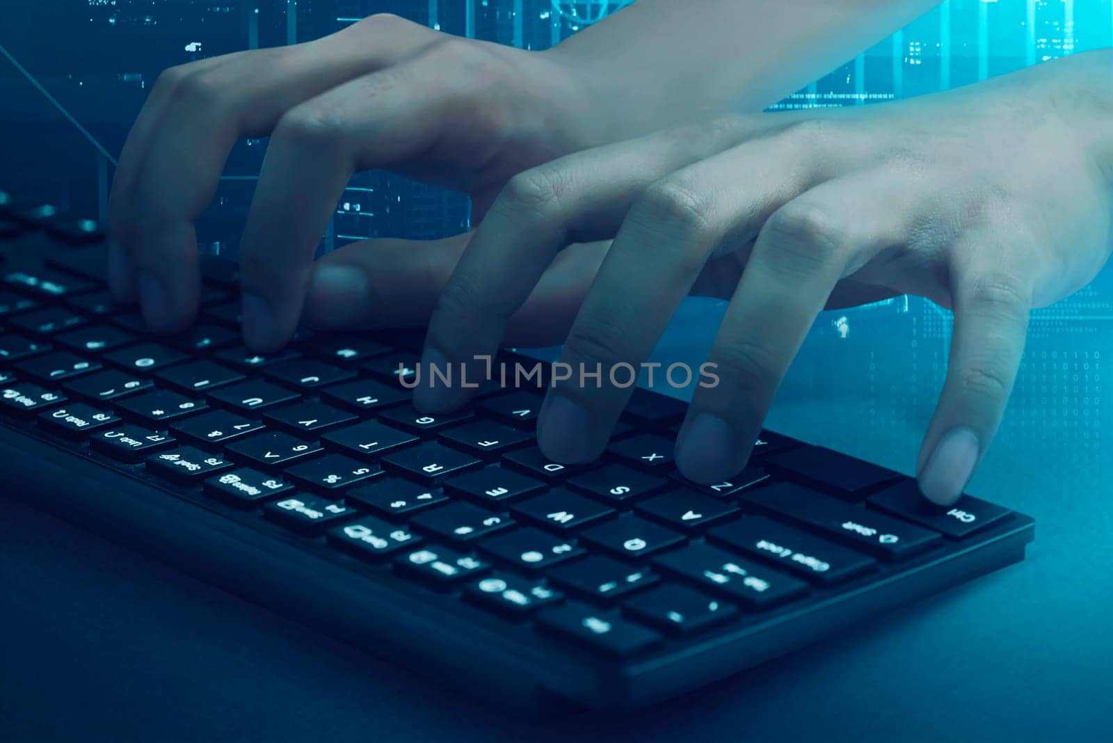 People hand  typing on the keyboard with visual background