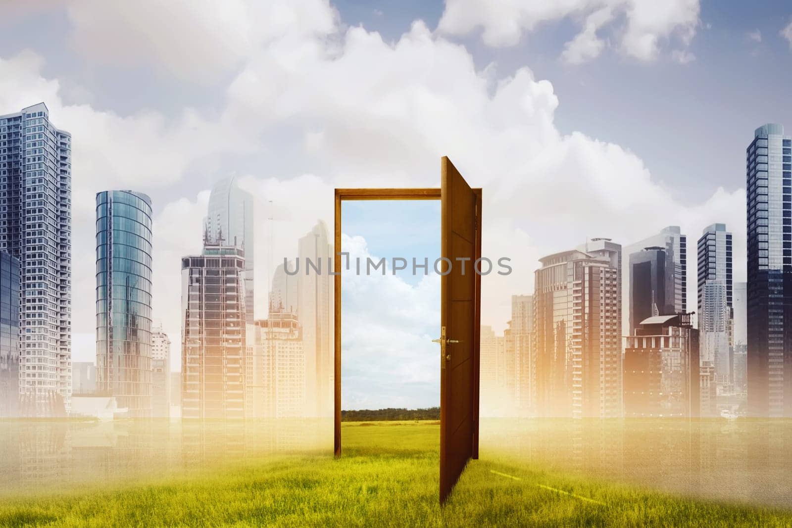 Open wooden door to the new world with green meadow against cityscape background