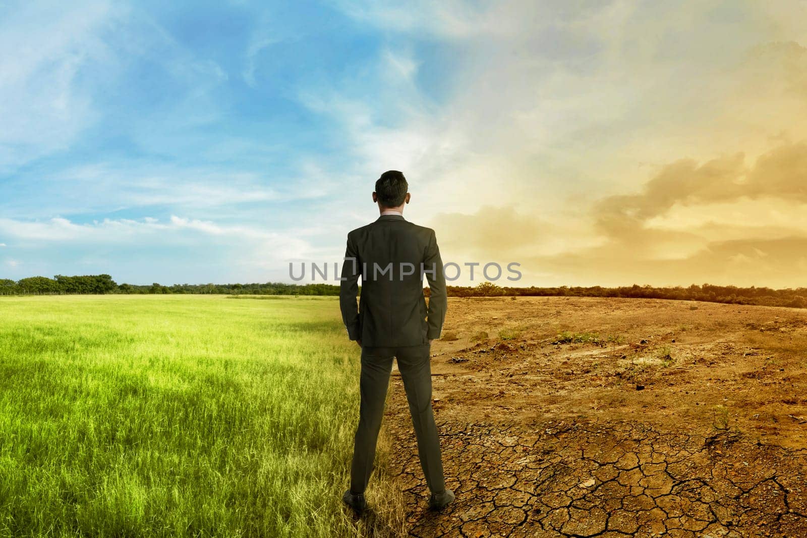 Asian businessman standing between different climate on the daylight