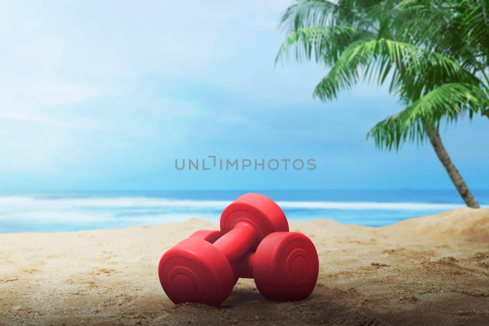 Red dumbbells for exercise on the beach