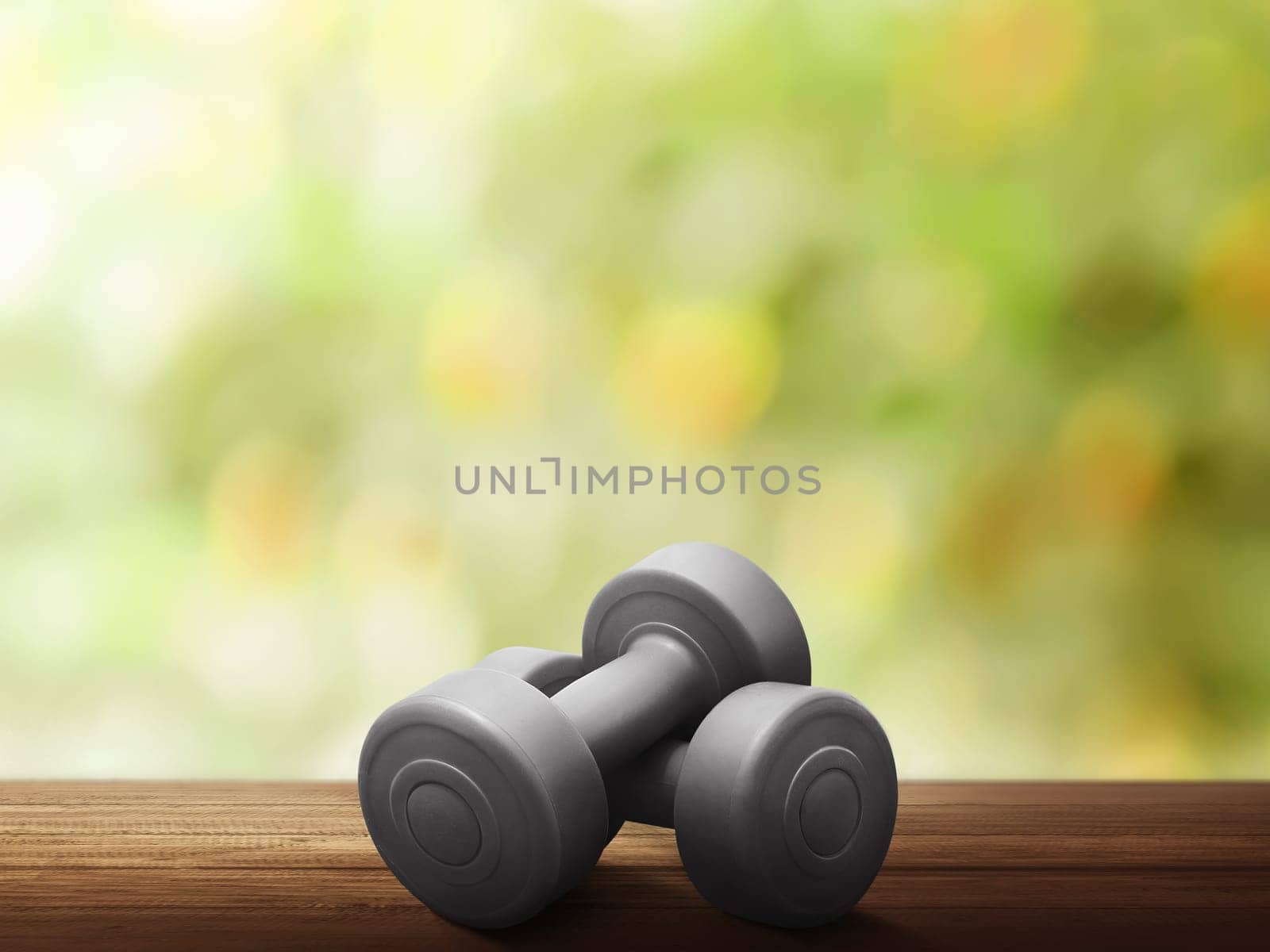 Red dumbbells for weight training on wooden table