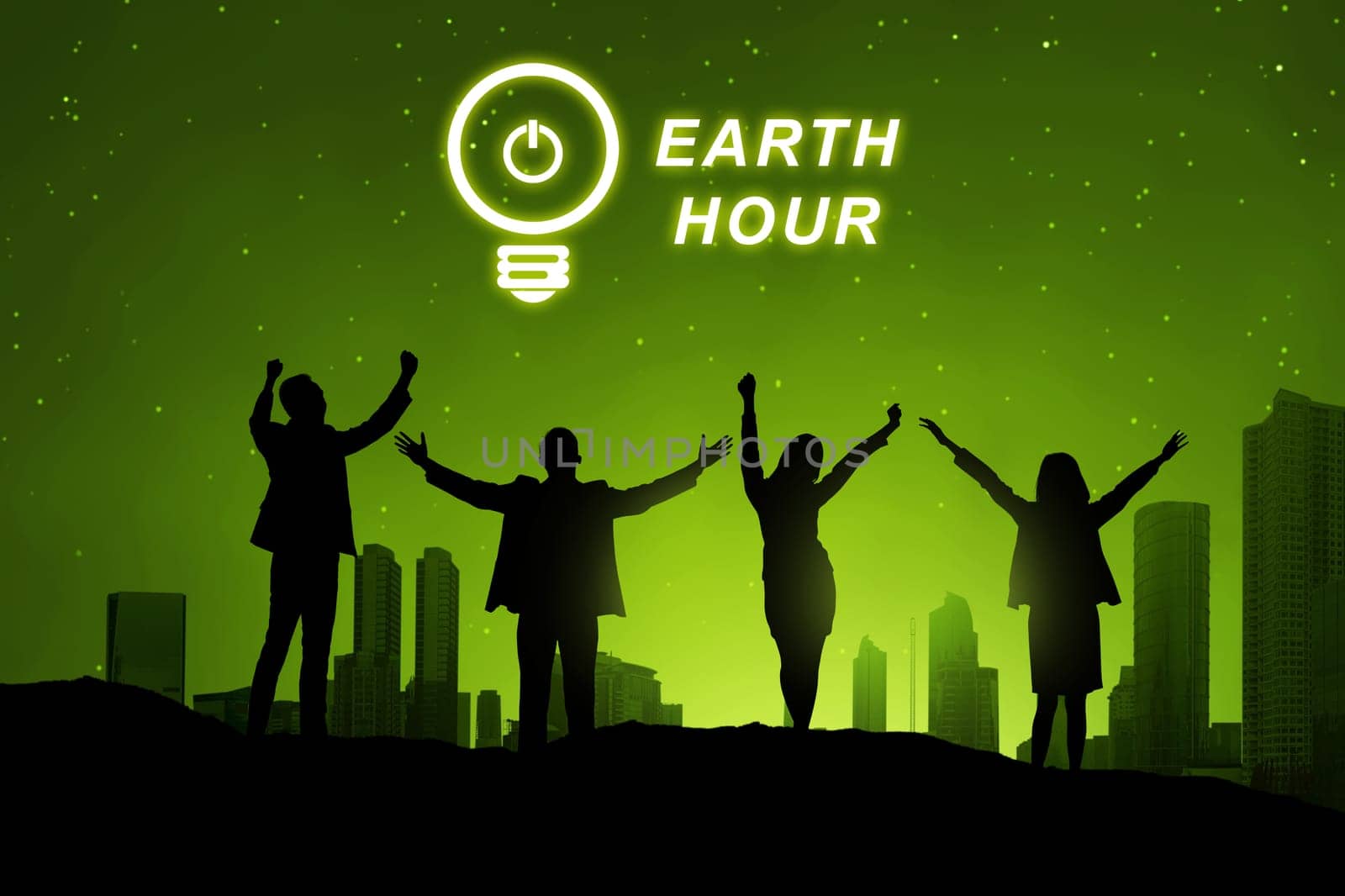 Silhouette of business people with Earth hour message over cityscape background