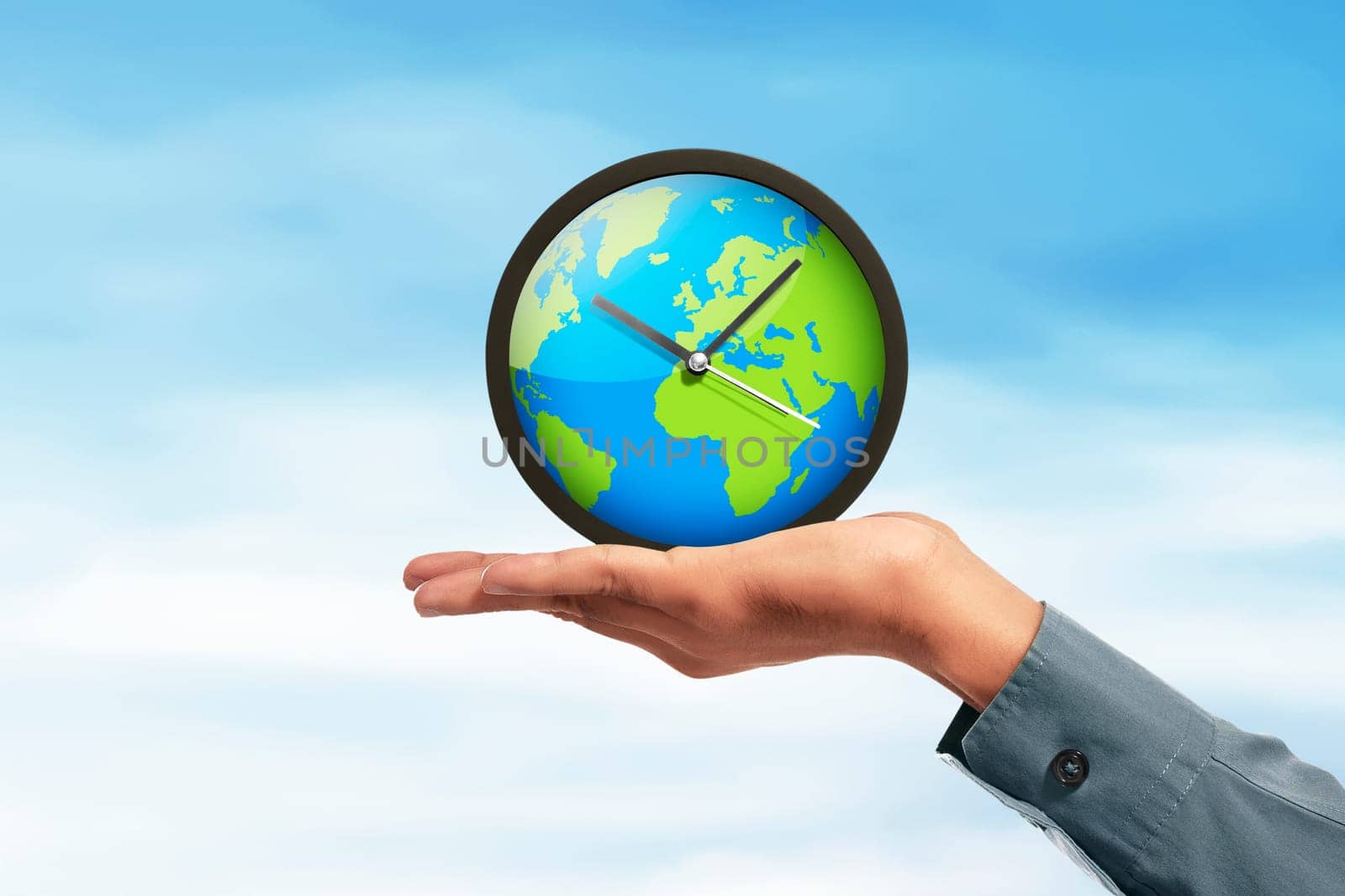 Earth globe clock in human hands over sky background