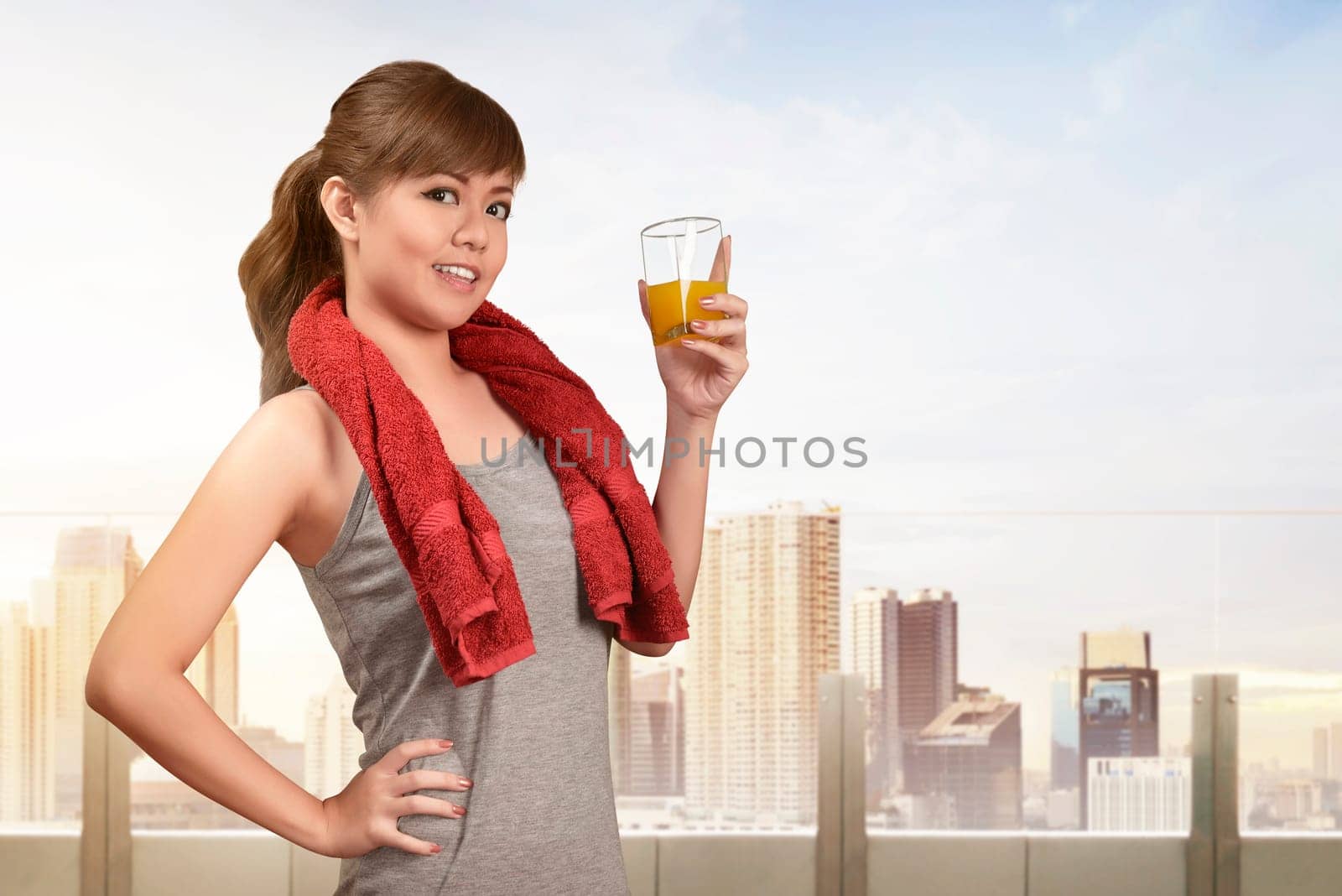 Smiling asian woman drinking a healthy natural juice for healthy diet concept