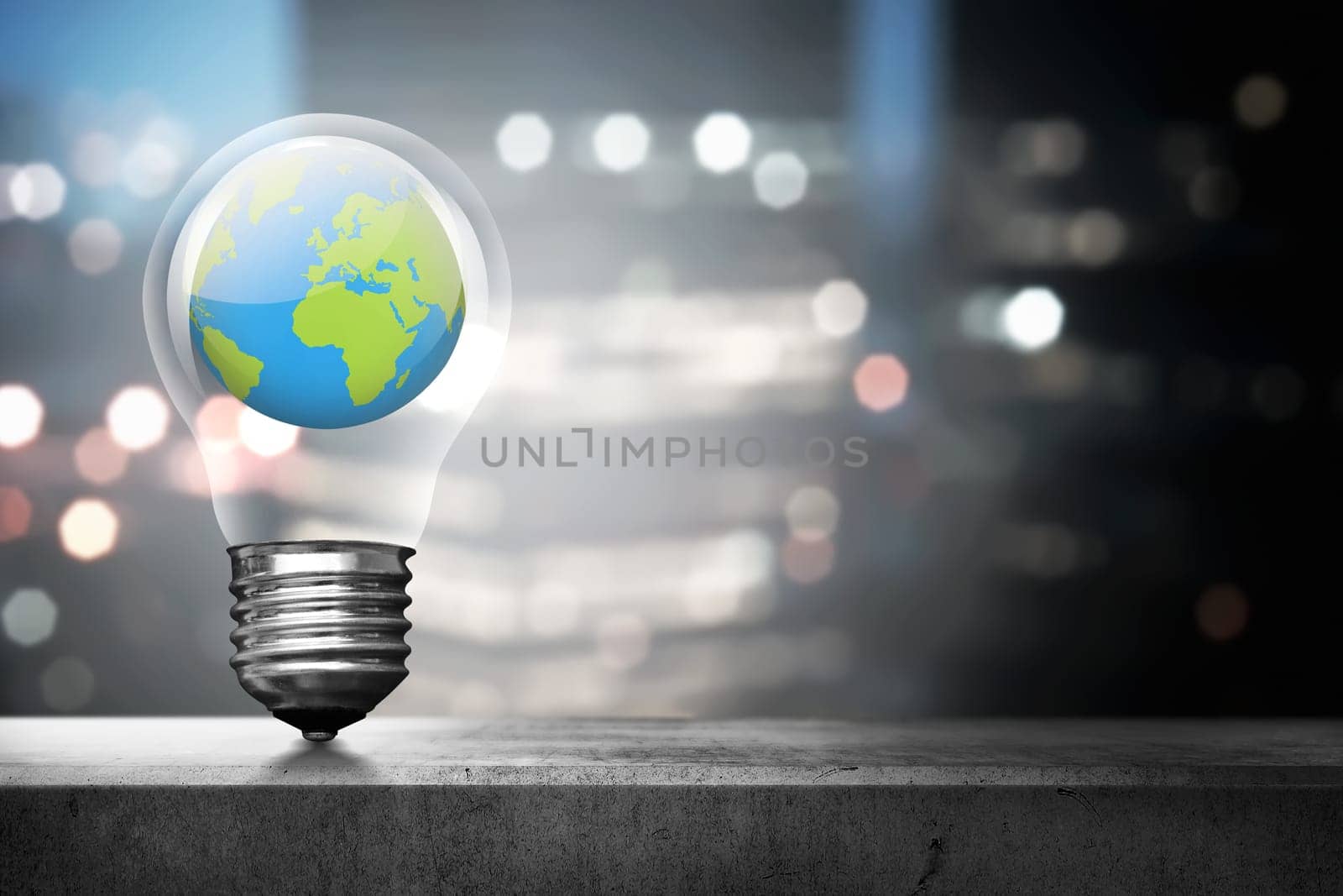 Portrait of earth inside light bulb over blurred light city background