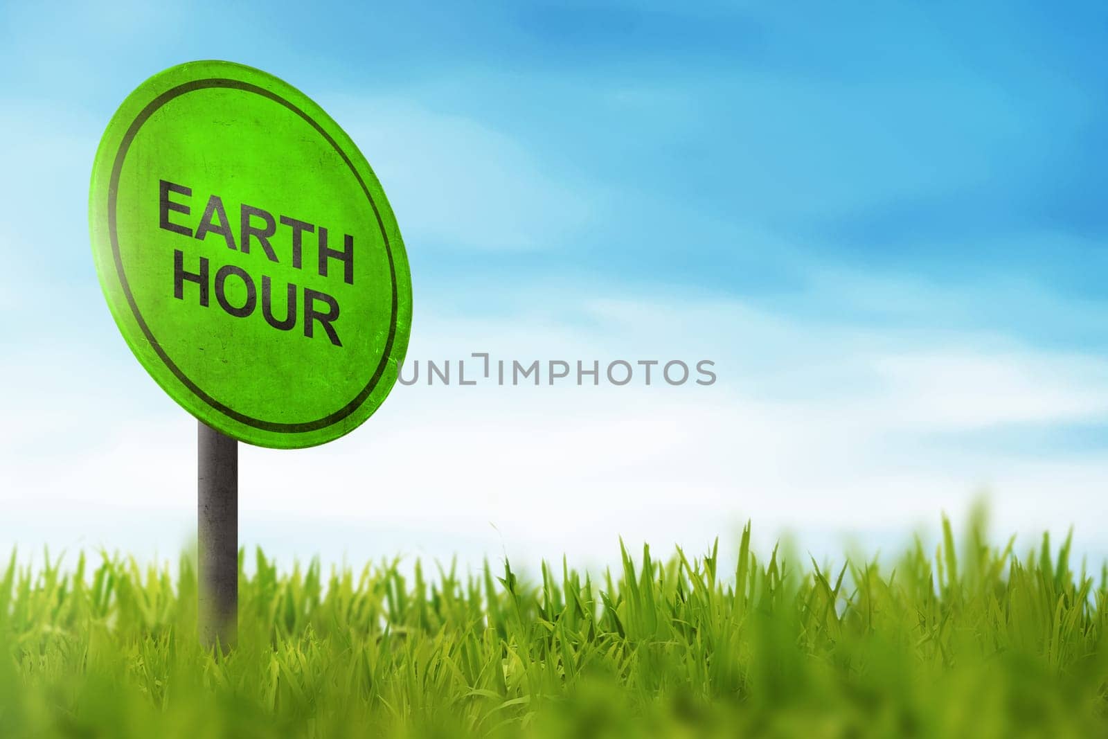 Earth Hour greeting on traffic sign in meadow field background