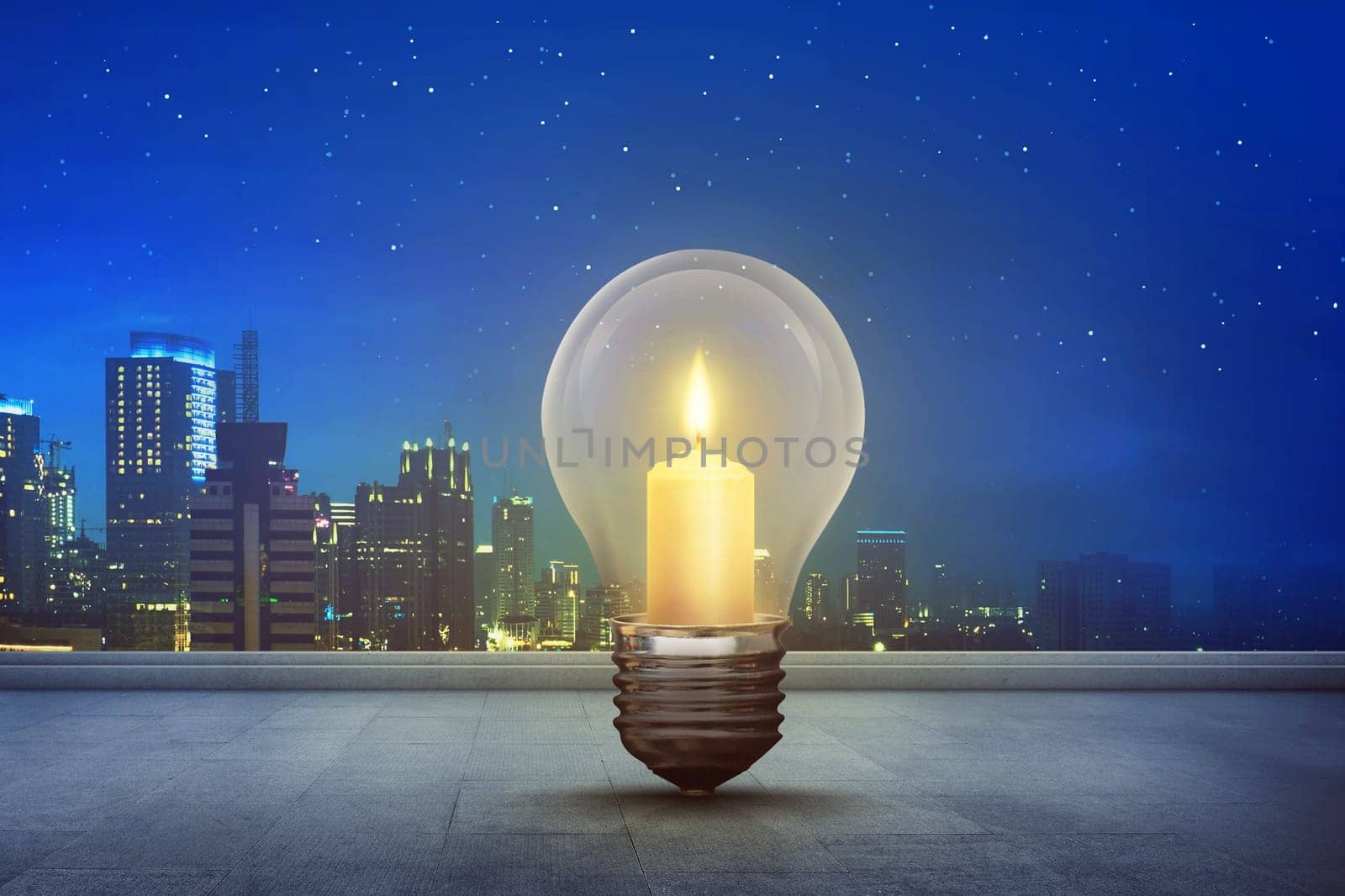 Burning candle inside light bulb on floor with modern city background