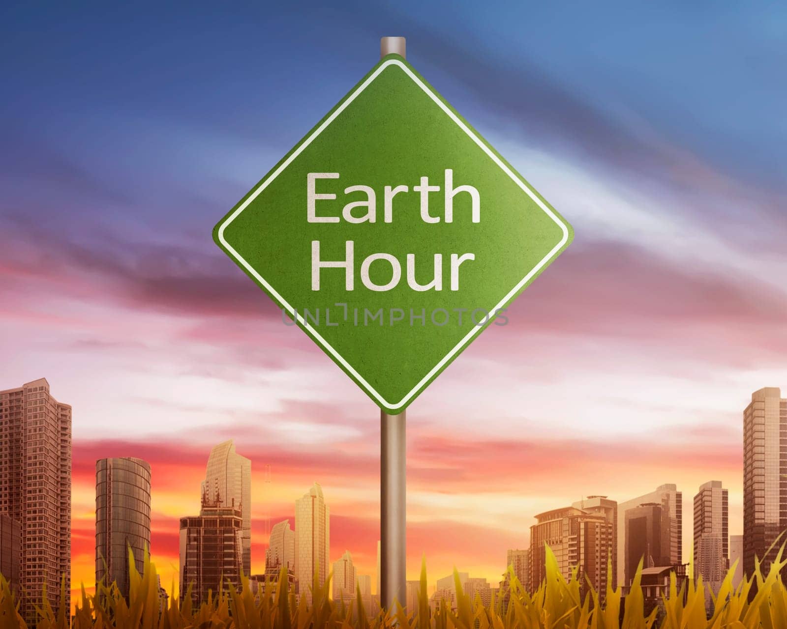 Earth Hour greeting on traffic sign at sunset in modern city