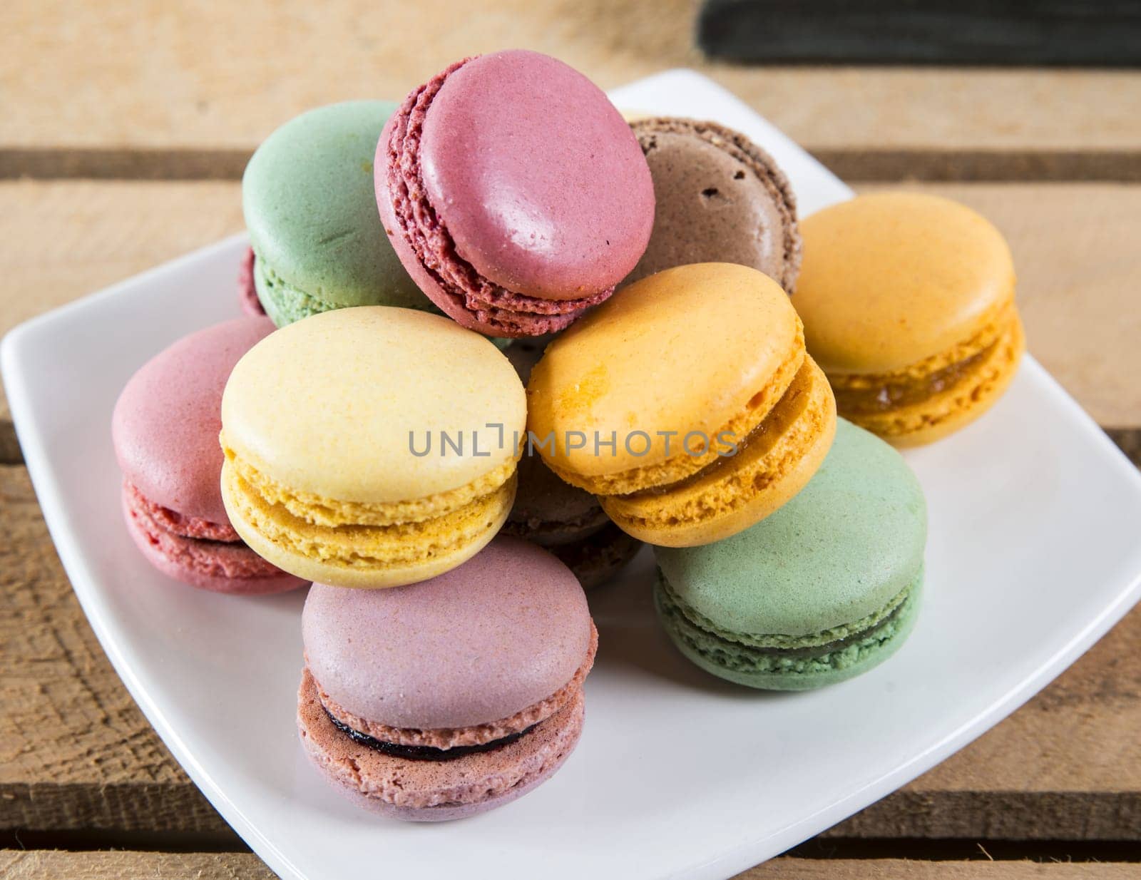 plate macaroons placed on a small wooden box