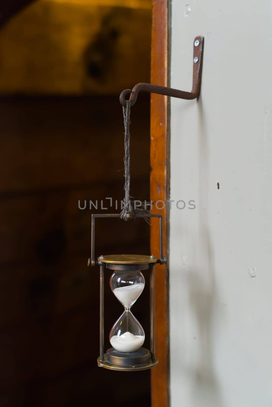antique hourglass on an old sailboat