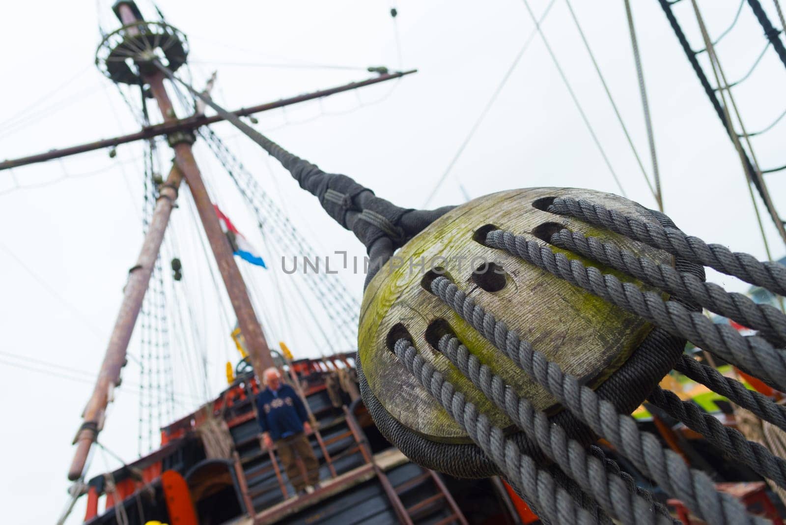 ancient wooden sailboat pulley on an old restored dutch VOC ship