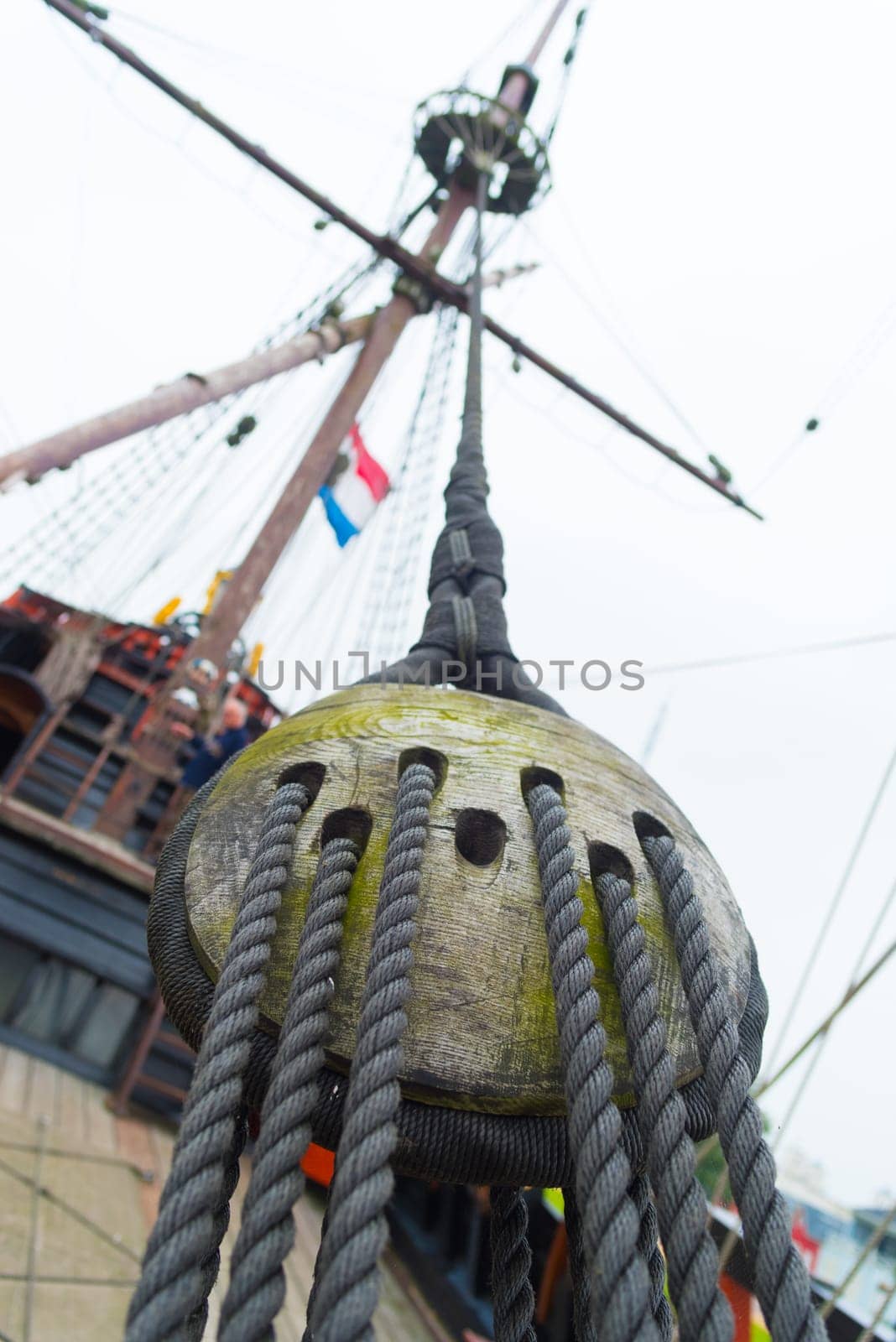 ancient wooden sailboat pulley on an old restored dutch VOC ship