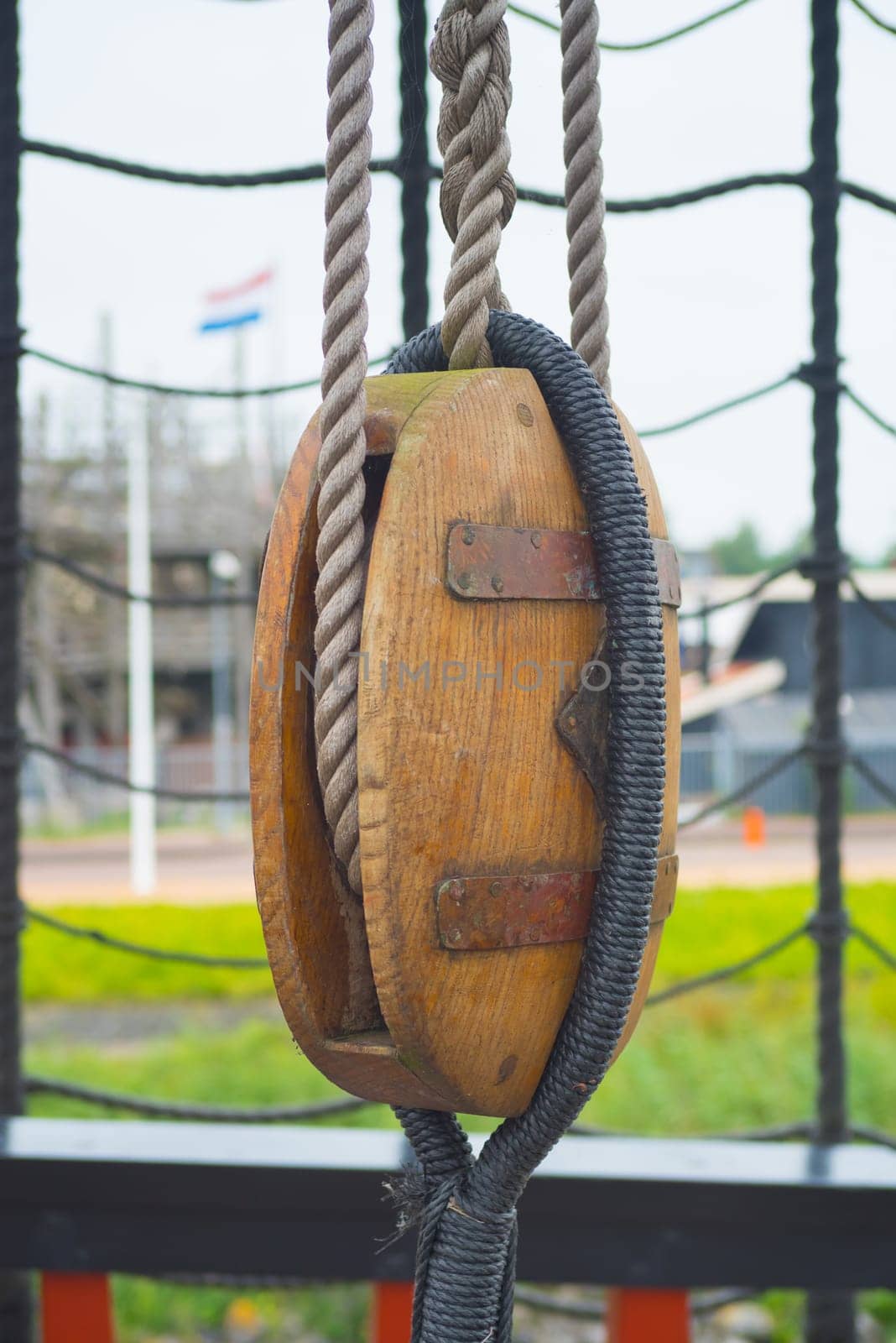 ancient wooden sailboat pulley on an old restored dutch VOC ship