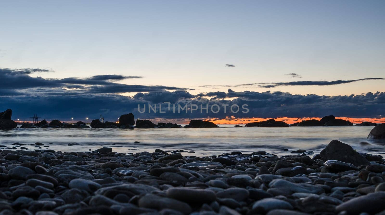 Sunset on the Baltic Sea, stony shore