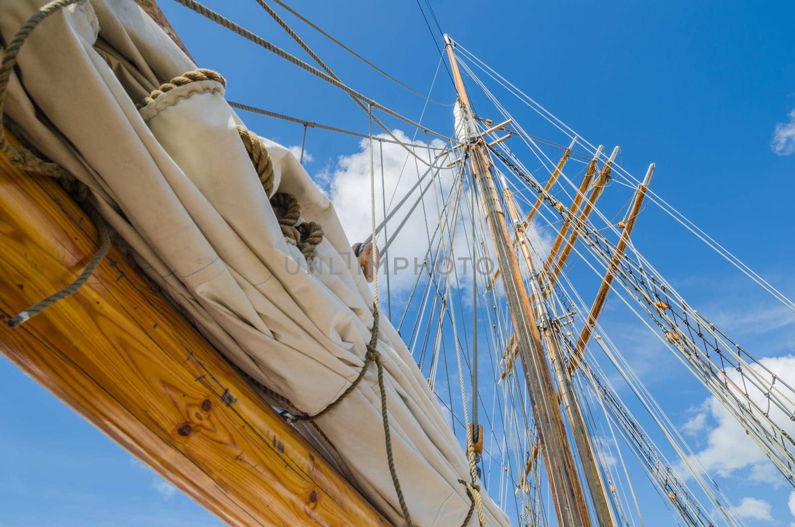 Folded sail and mast on an old sailboat