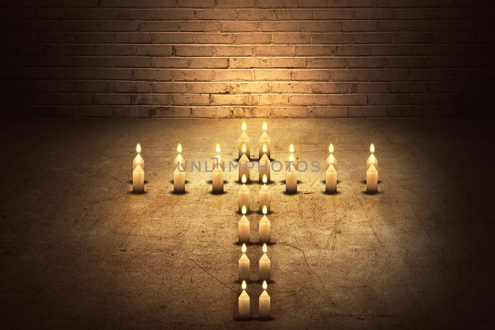 Burning candles in the form of a cross on the dark room