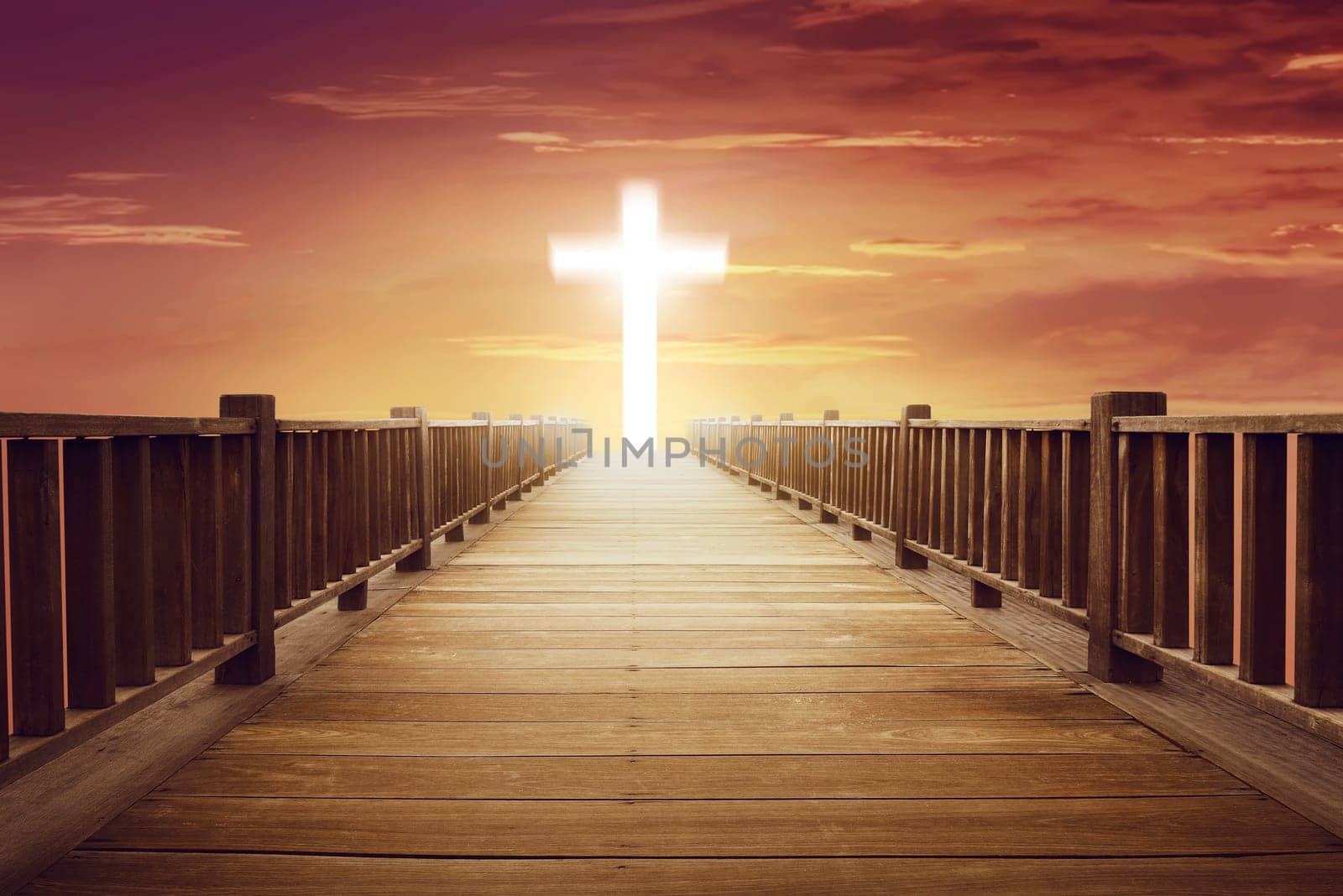 Shine cross shape in the end of wooden path at sunset