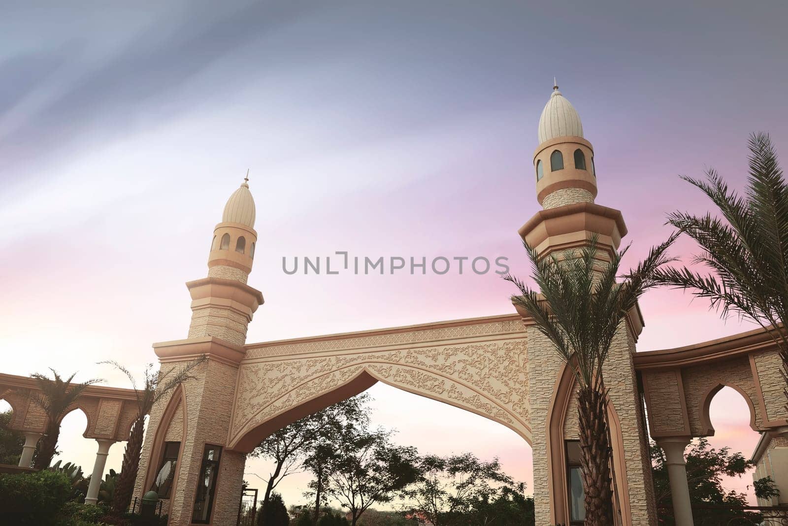 Modern architecture building with green park over sunset background