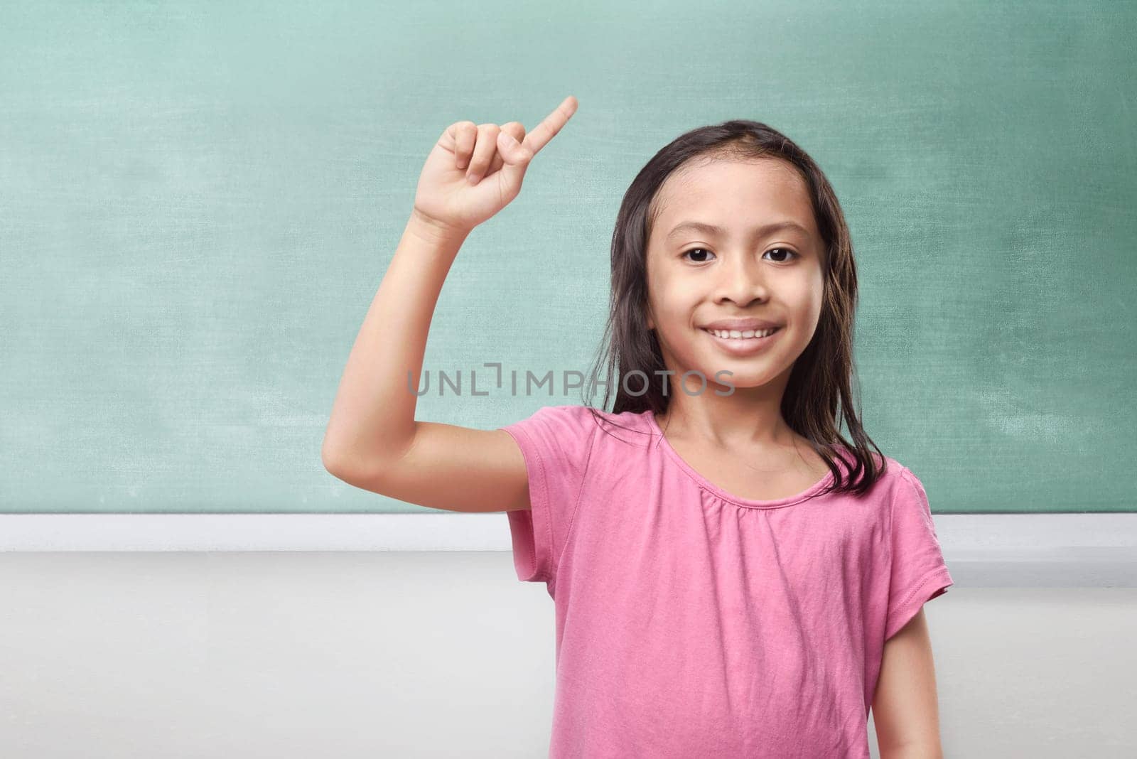 Portrait of asian little girl thinking and having idea in the classroom