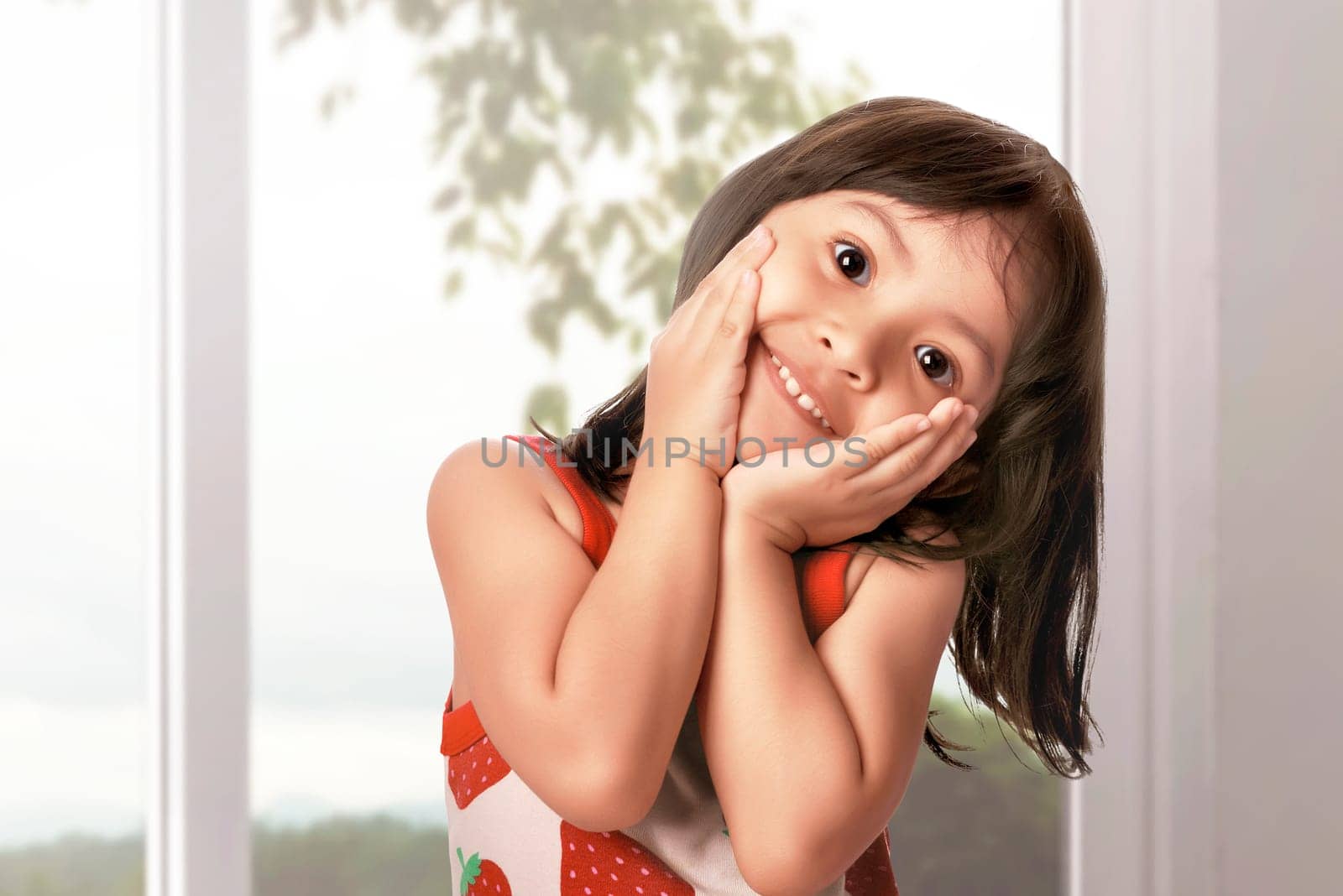 Happy asian little girl having fun at the home