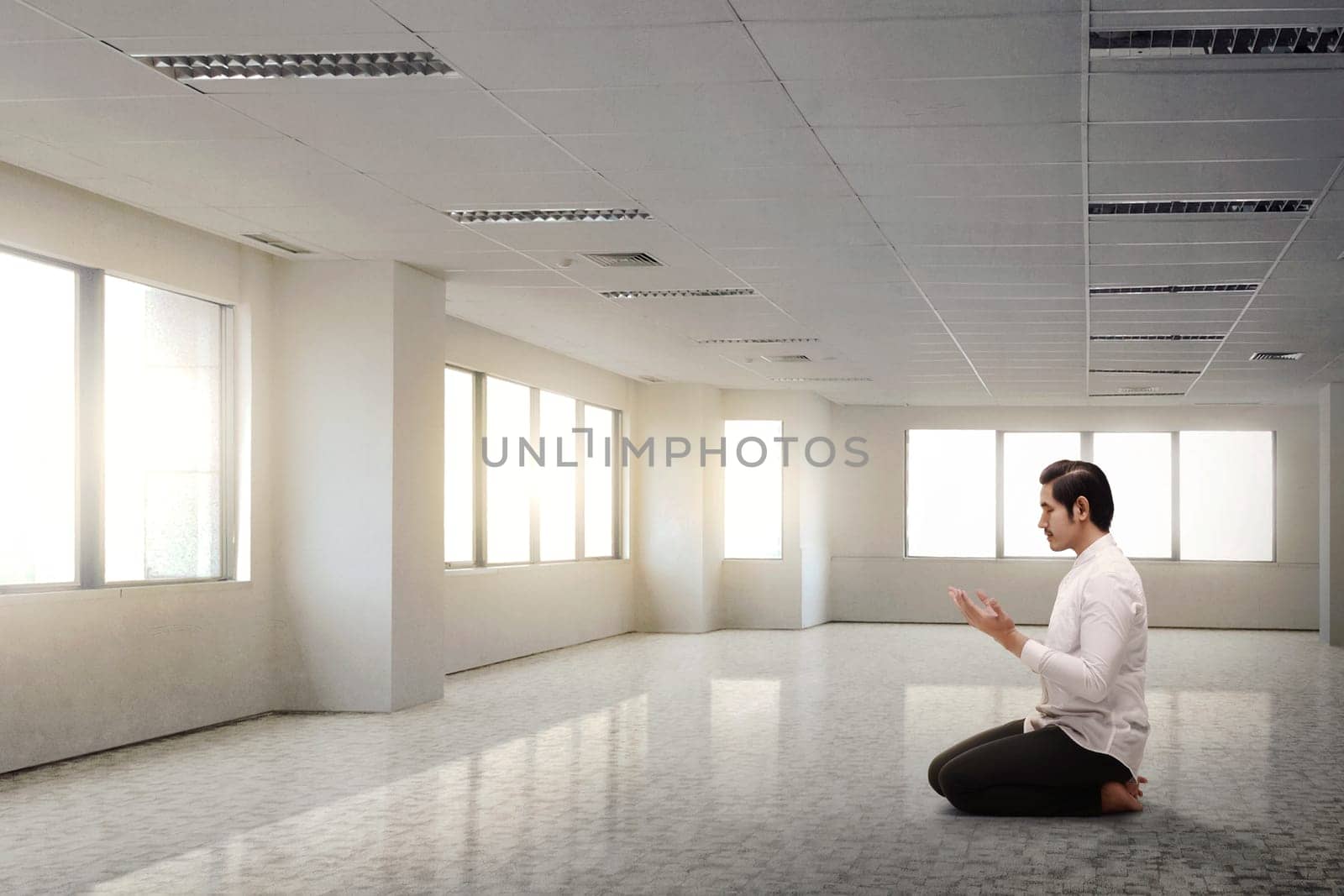 Religion asian muslim man kneeling and praying by h9images