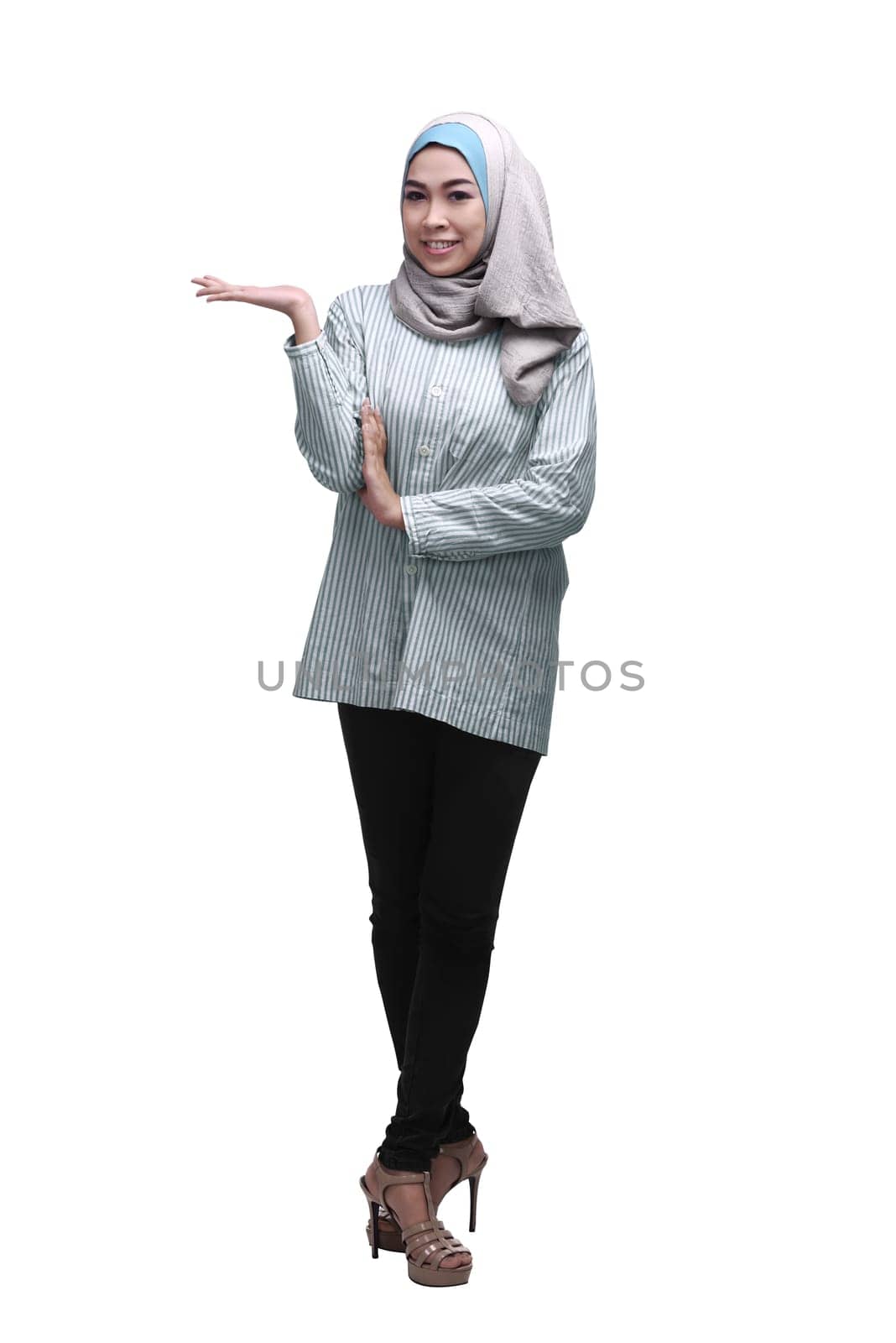Young asian muslim woman with hijab showing copyspace area isolated over white background