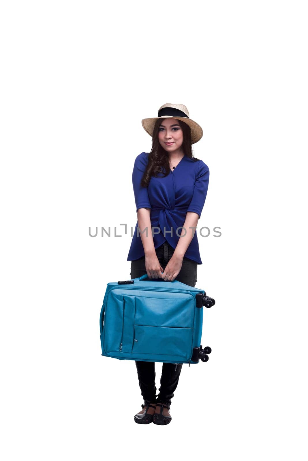 Beautiful asian woman tourist with blue suitcase standing isolated over white background