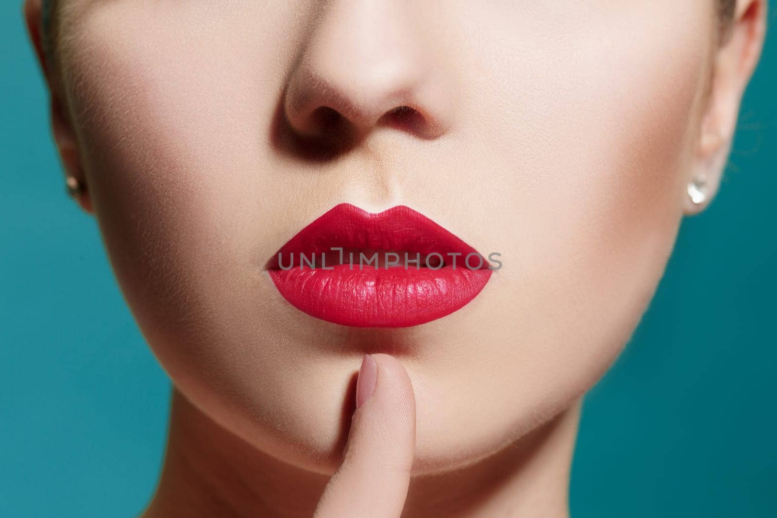 The sensual portrait of beautiful woman model lady with fresh daily makeup with red lips and clean healthy skin face