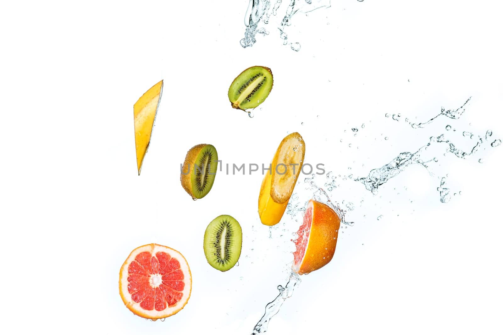 The fresh fruits falling with water splash, isolated on white background
