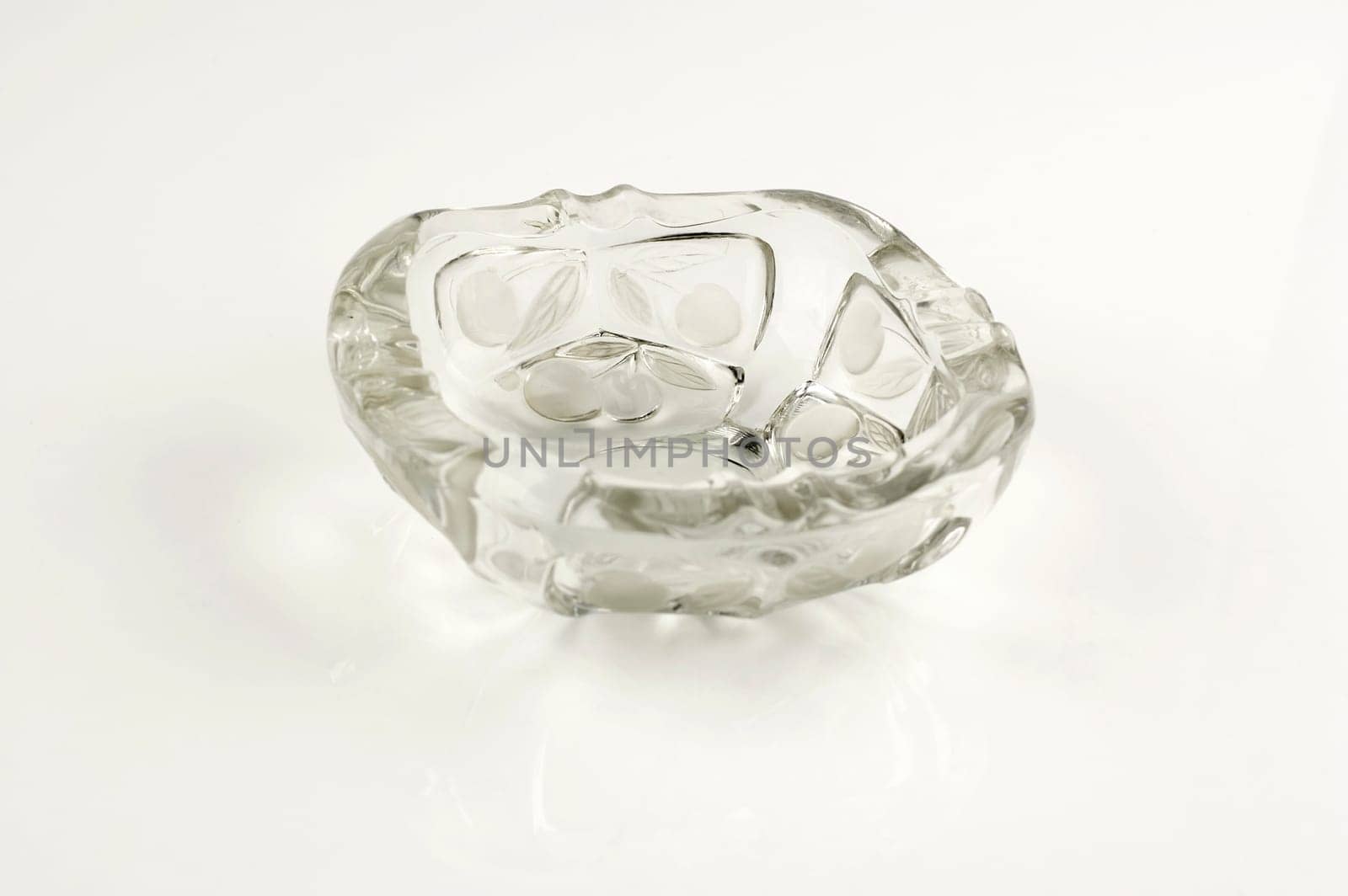 One glass ashtray isolated on white background