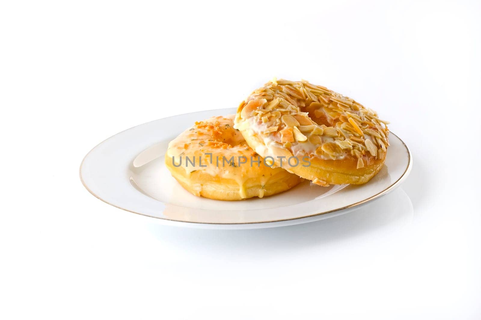 Two doughnut on plate on white background