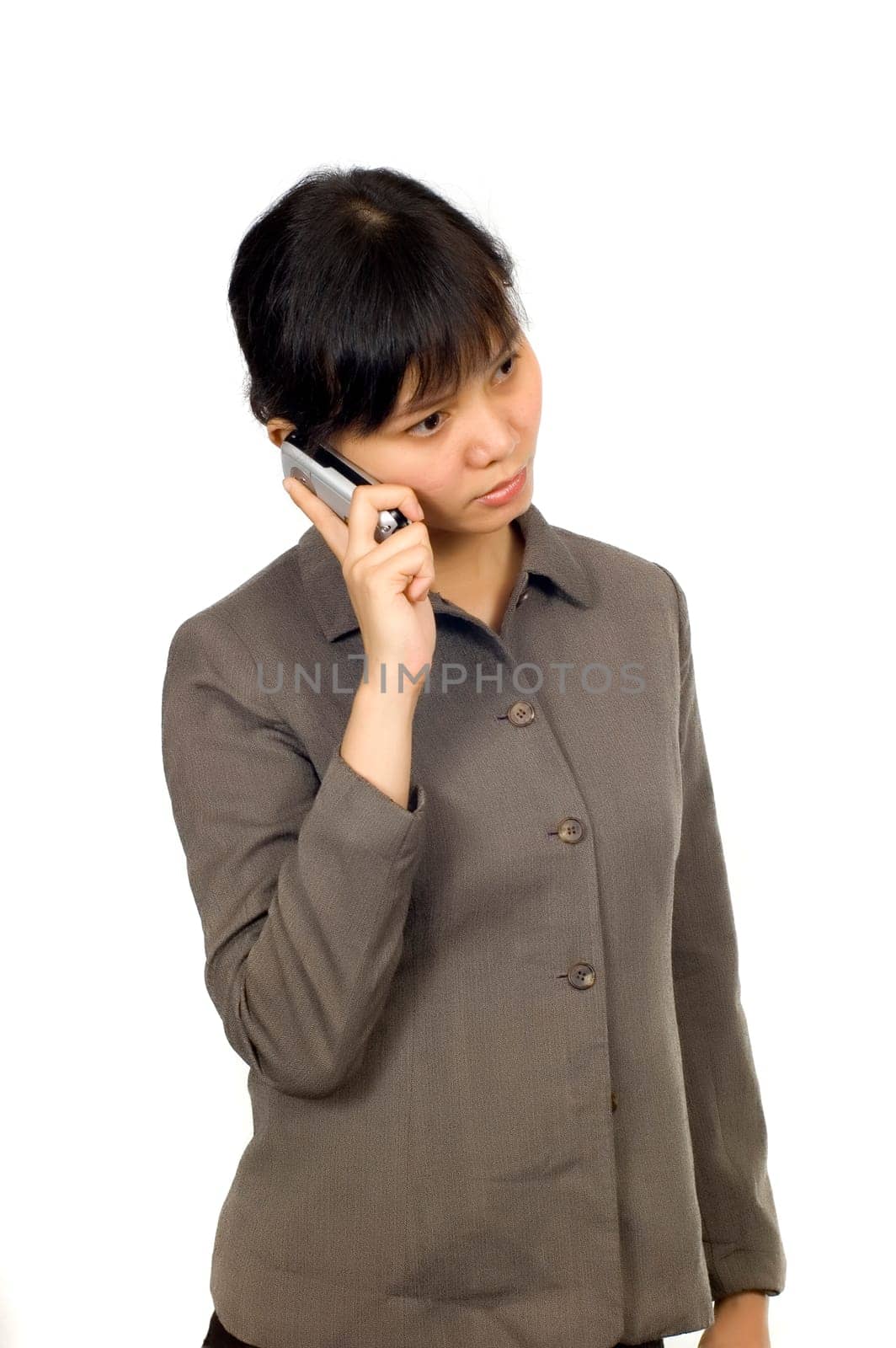 Pretty Asian Woman, hear a bad news on her cellphone