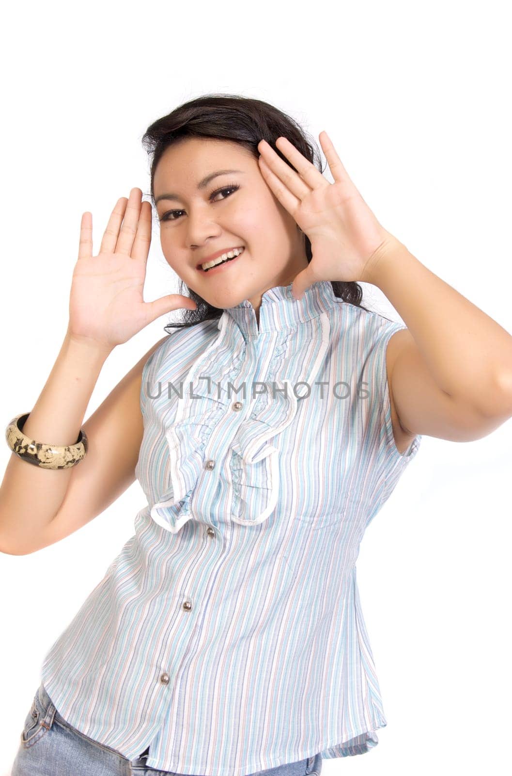Asian Model Posing at white background. She looks pretty and fresh and framing her face