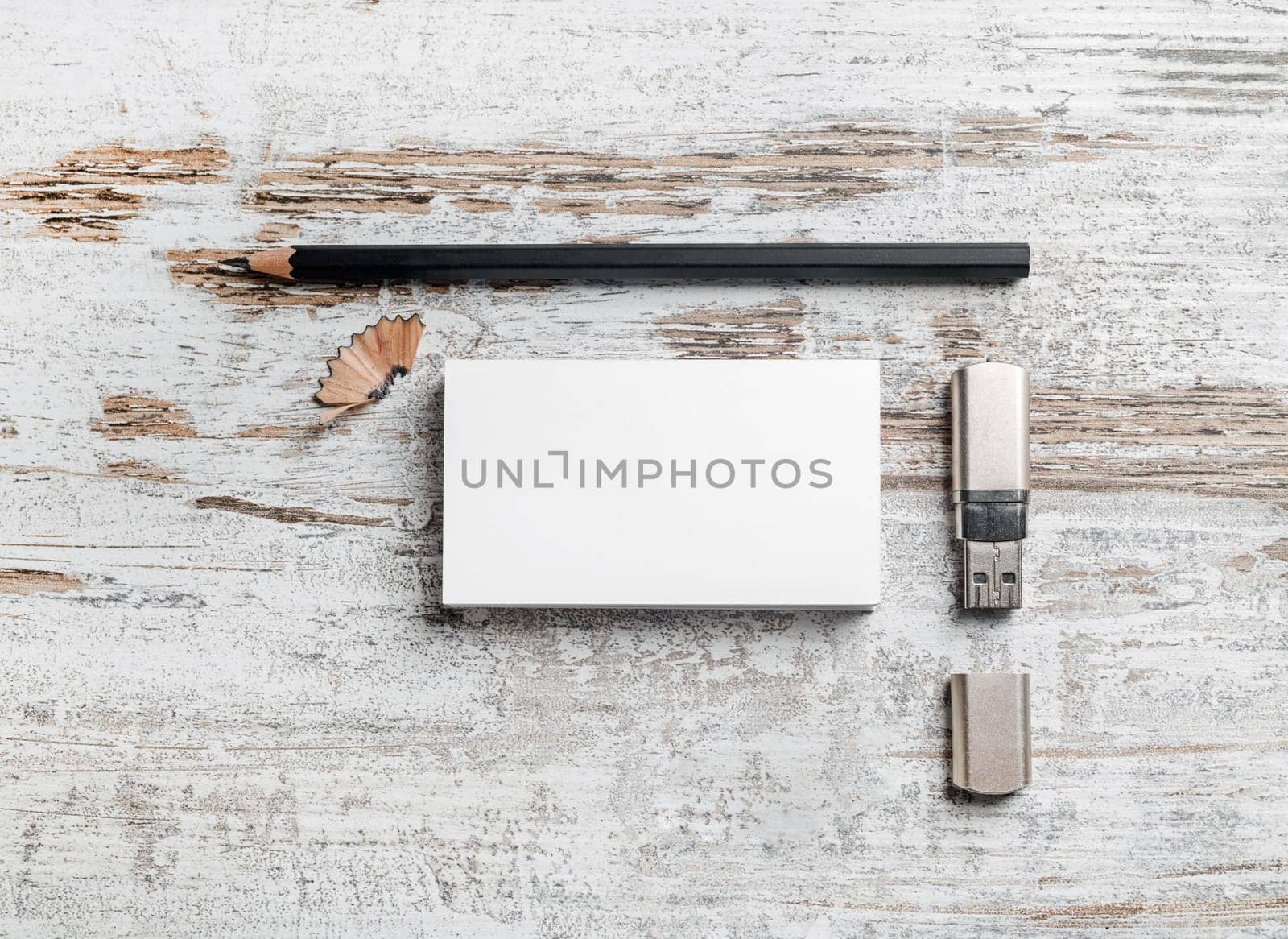 Blank stationery set. Business cards, pencil and usb flash drive on vintage wood background. Template for branding identity. Top view.