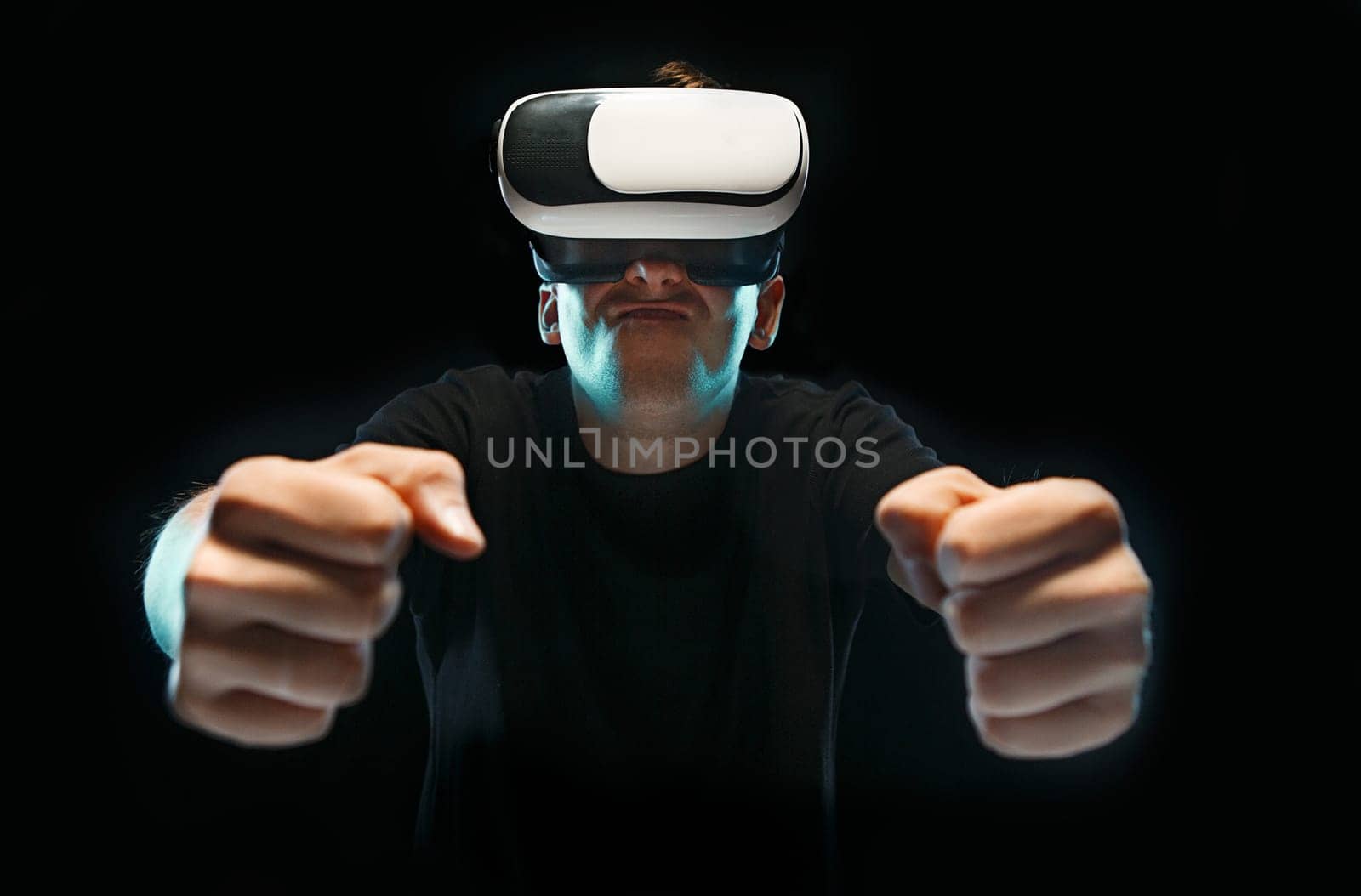 The man with glasses of virtual reality. Future technology concept. Black studio background