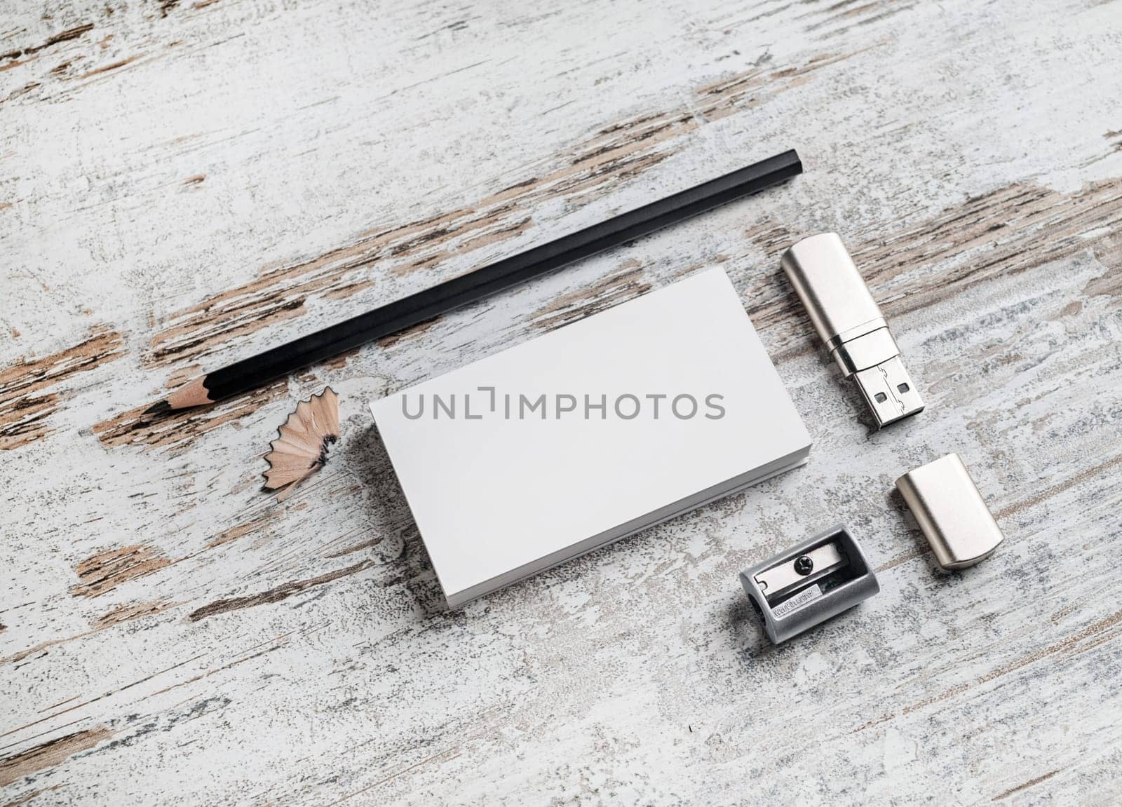 Template for ID. Responsive design mockup. Bank business cards, pencil, flash drive and sharpener on vintage wooden table background. Top view.