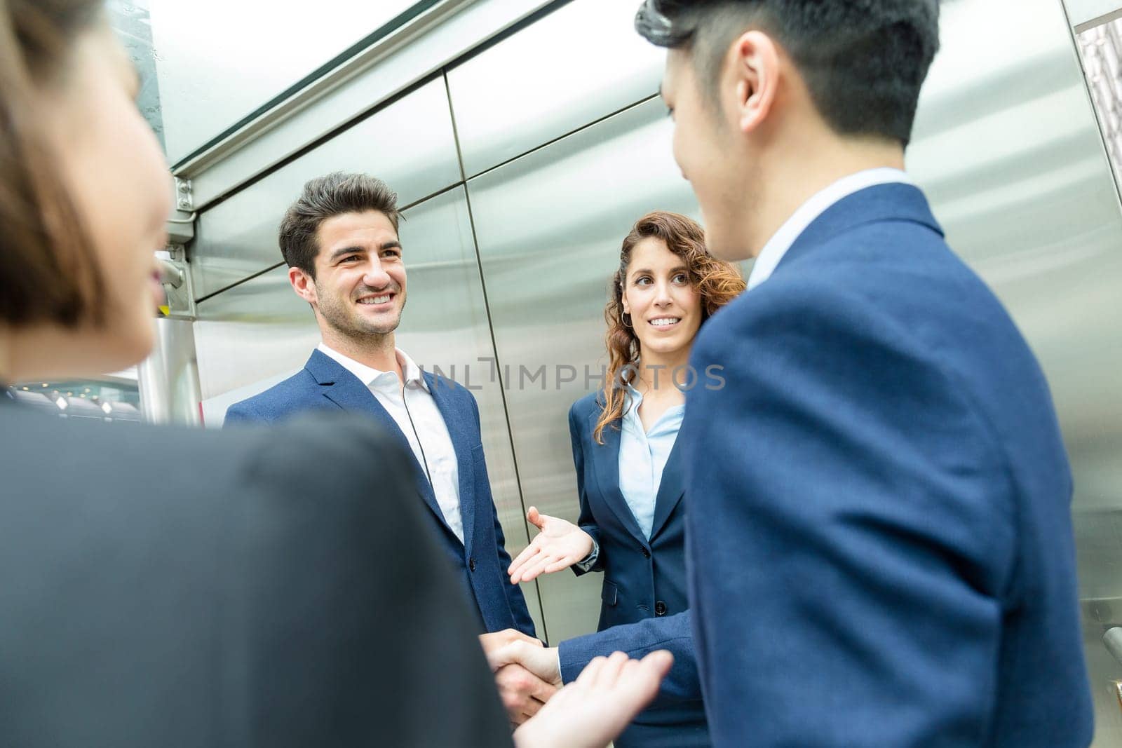 Group of business people discuss to each other