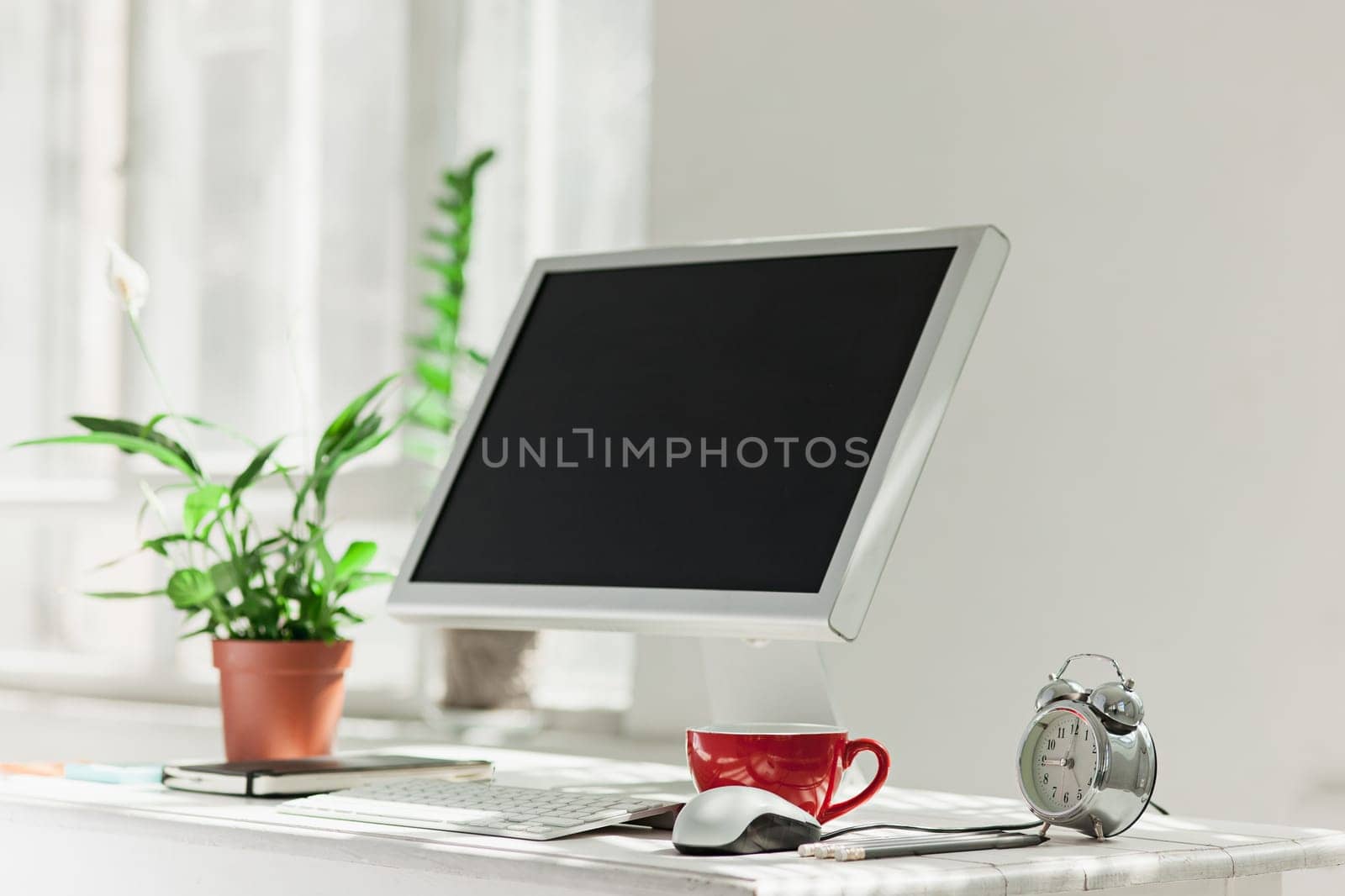 Stylish white workspace with computer on home or studio