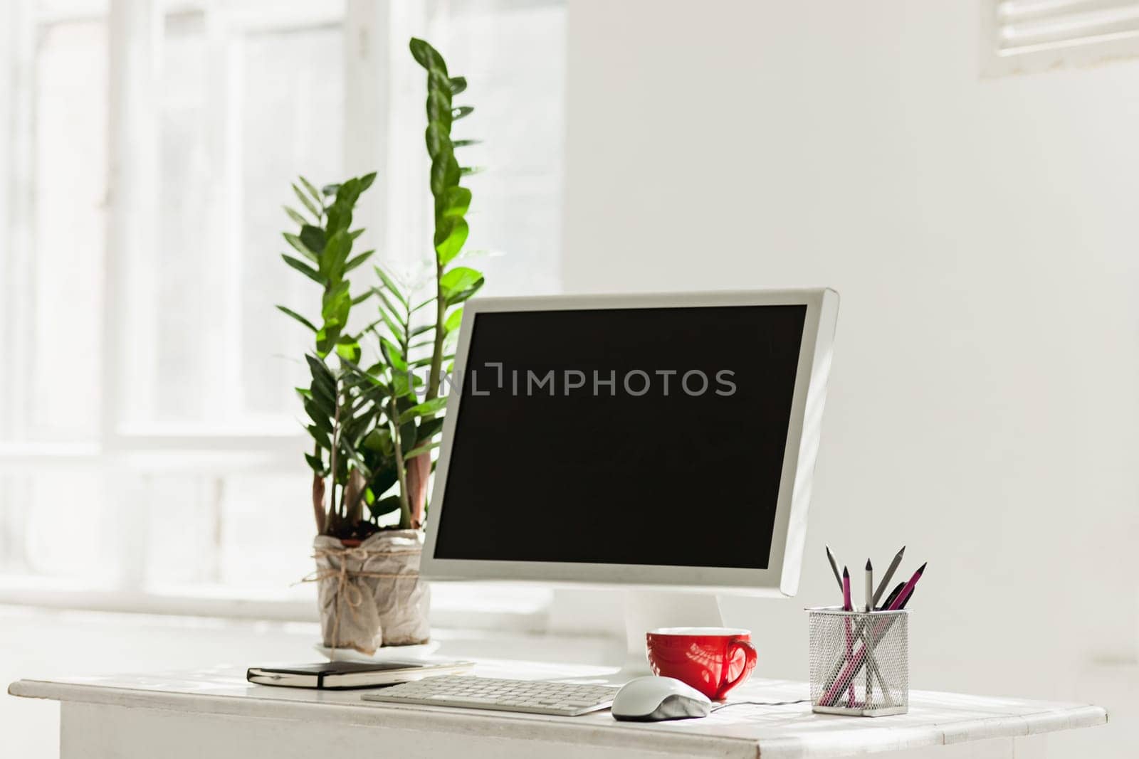 Stylish white workspace with computer at home or studio