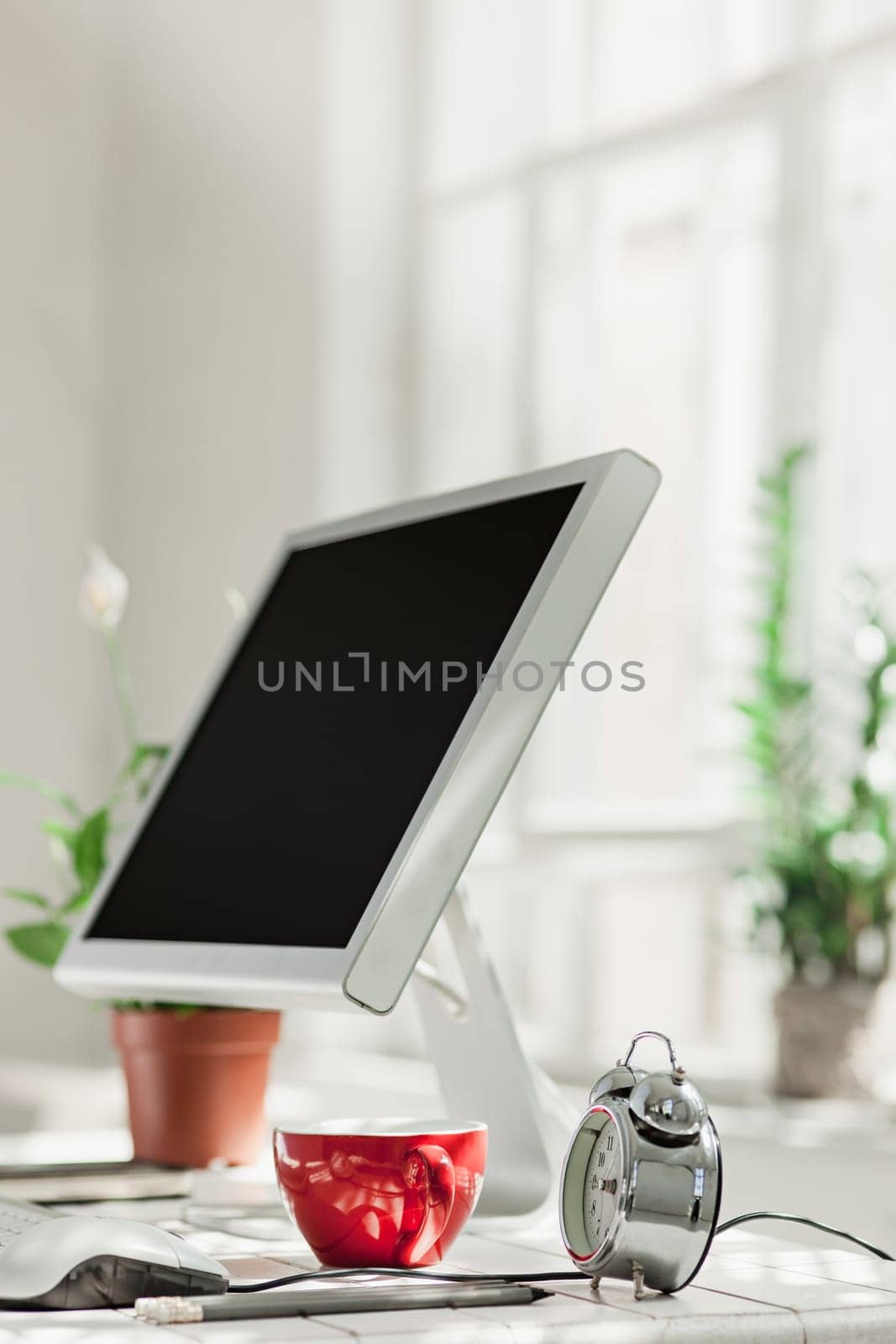 Stylish white workspace with computer on home or studio