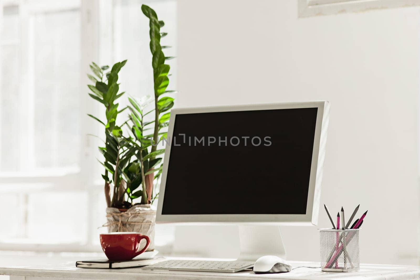 Stylish white workspace with computer on home or studio