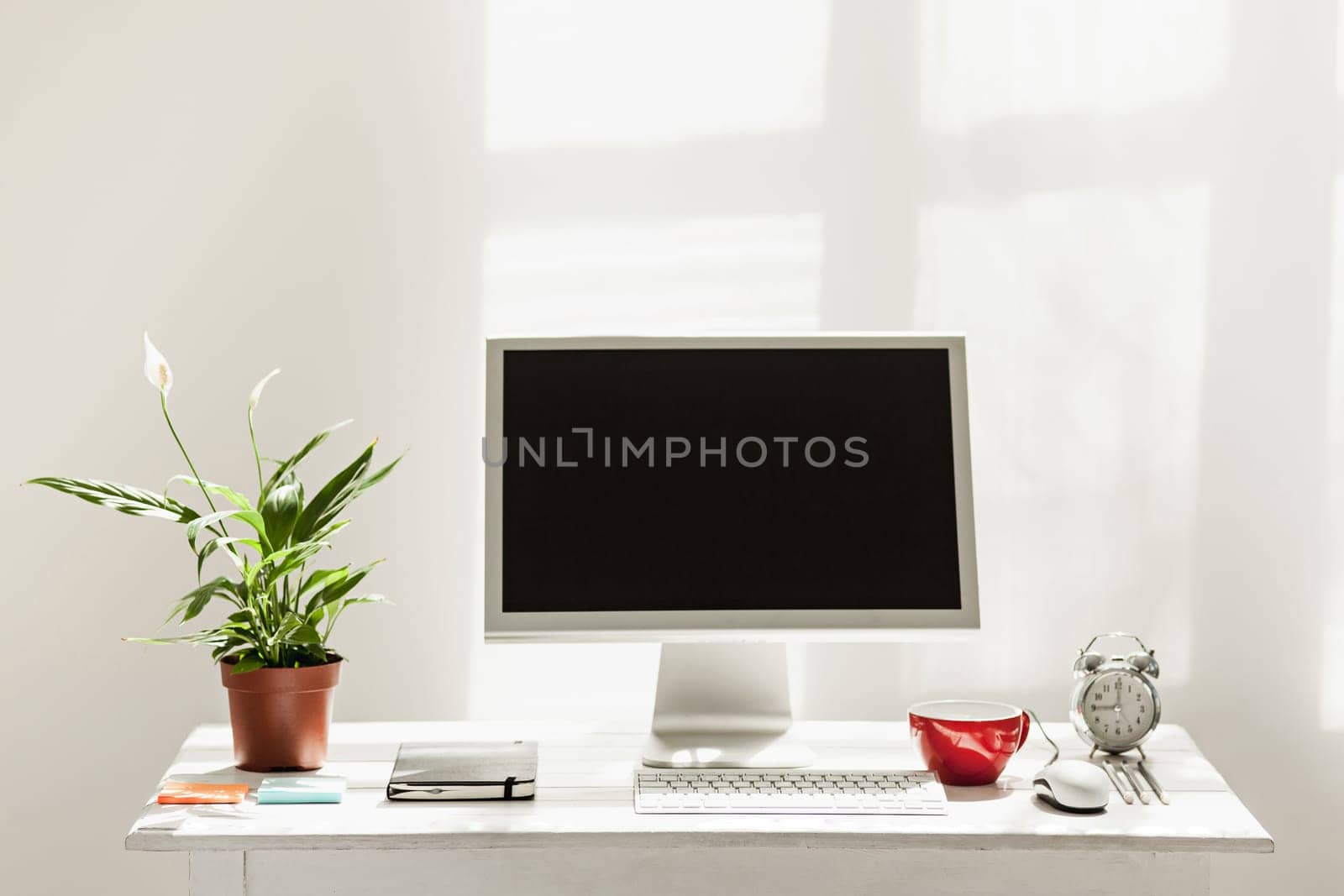 Stylish white workspace with computer on home or studio