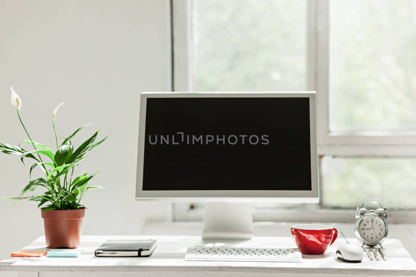 Stylish white workspace with computer on home or studio
