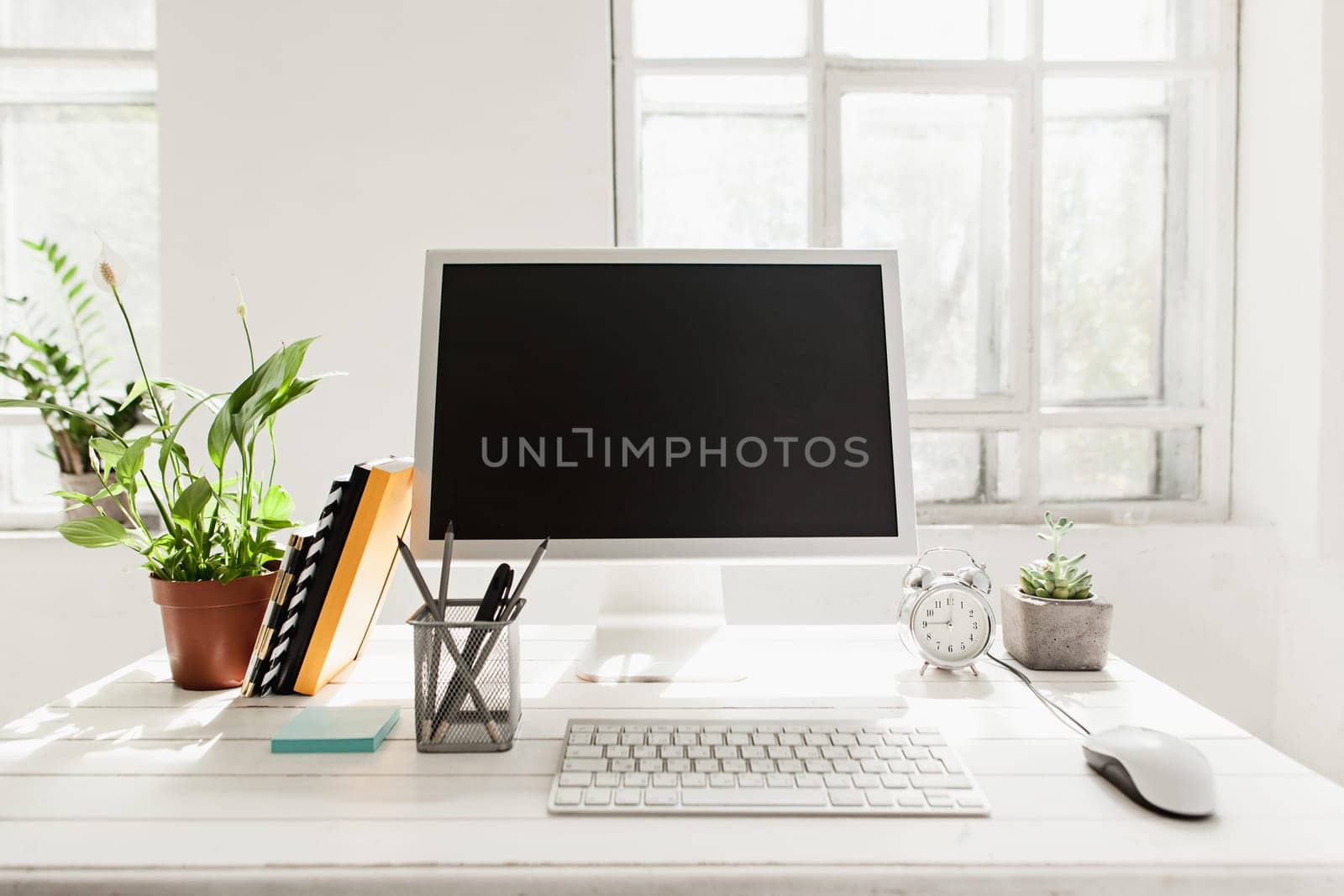 Stylish white workspace with computer at home or studio