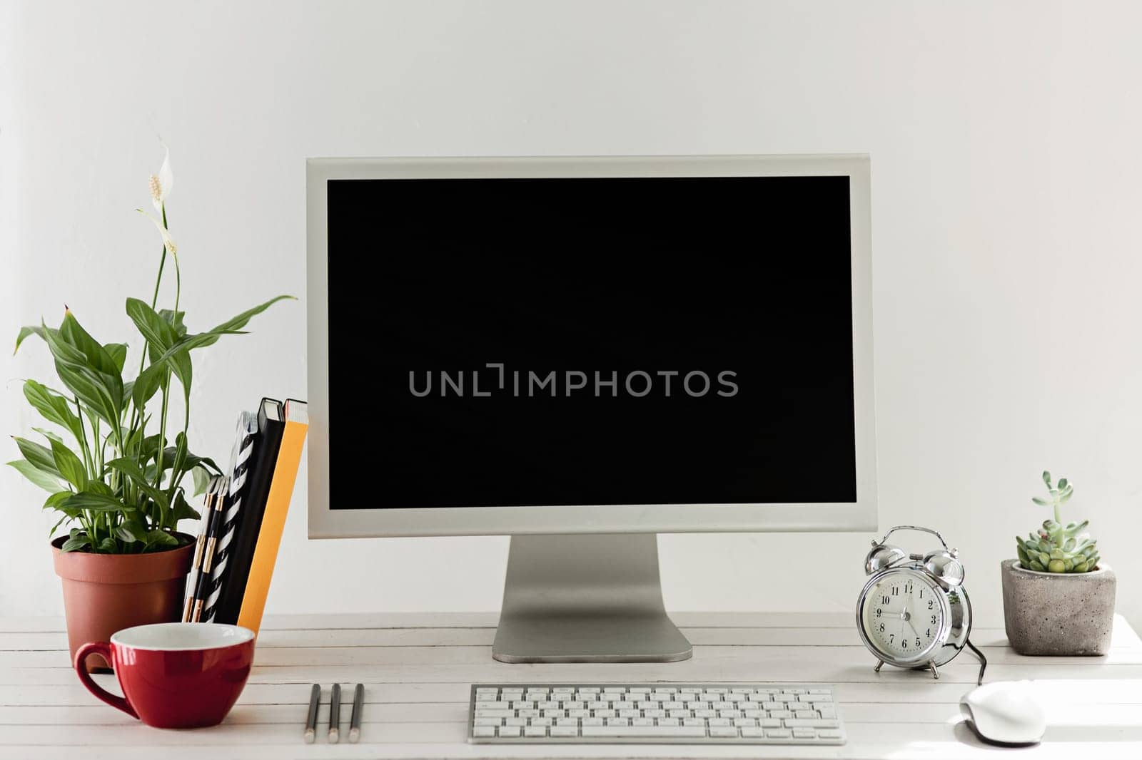 Stylish white workspace with computer on home or studio